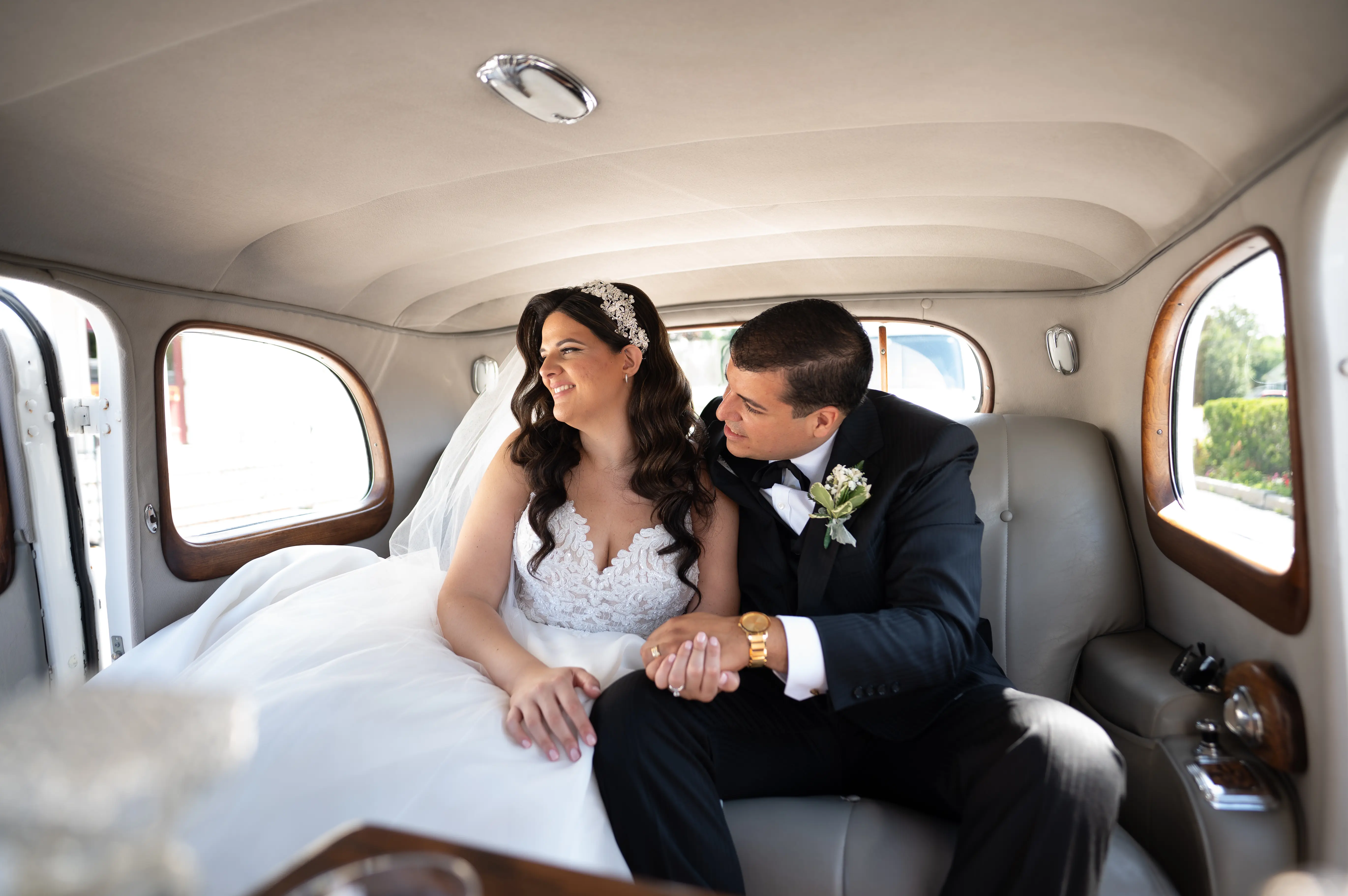 Bride In A-line Wedding Dress Named Savannah By Maggie Sottero Bride and Groom In Car