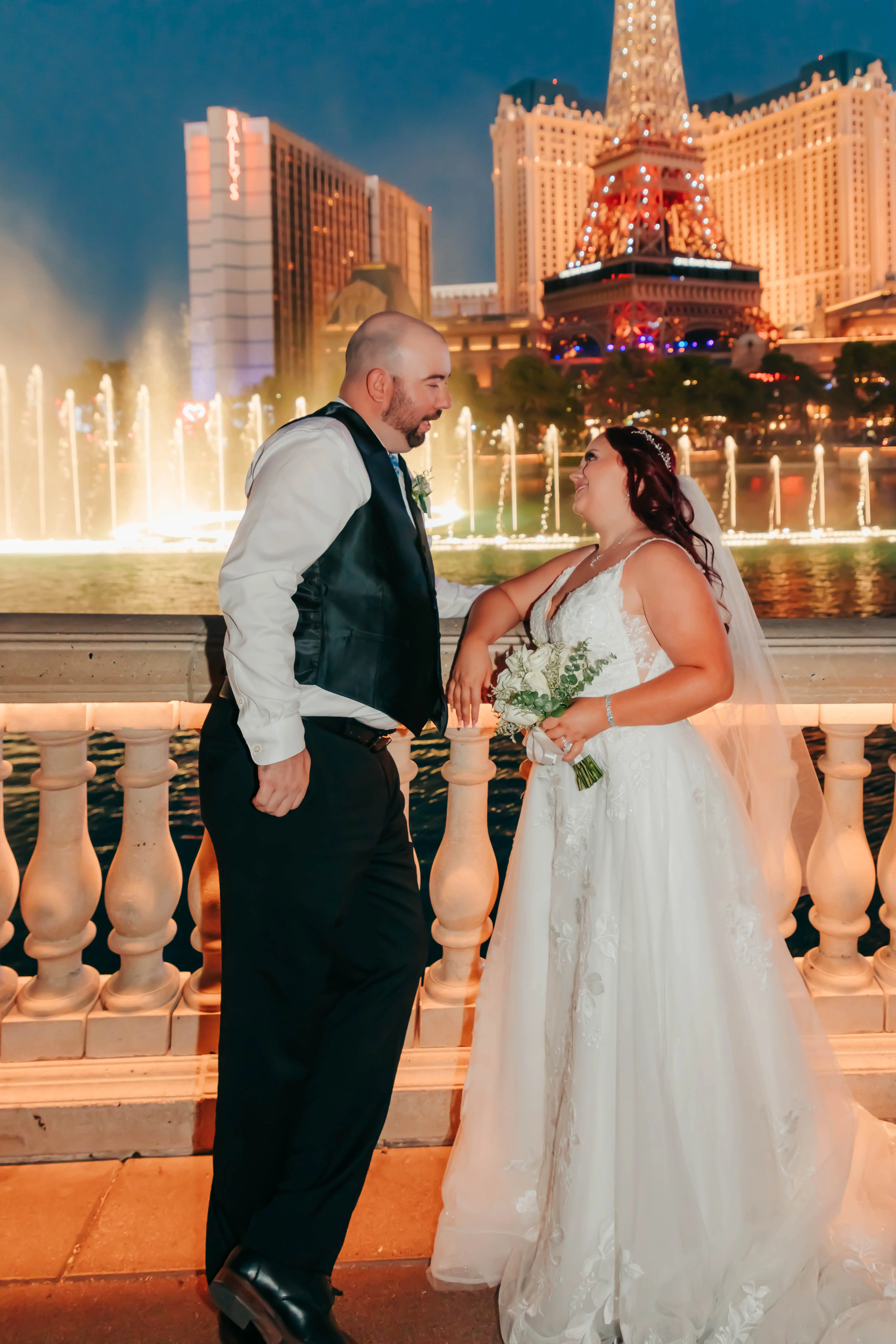 Groom and Bride at a Las Vegas Wedding Wearing Lace Ballgown Called Ellen by Rebecca Ingram