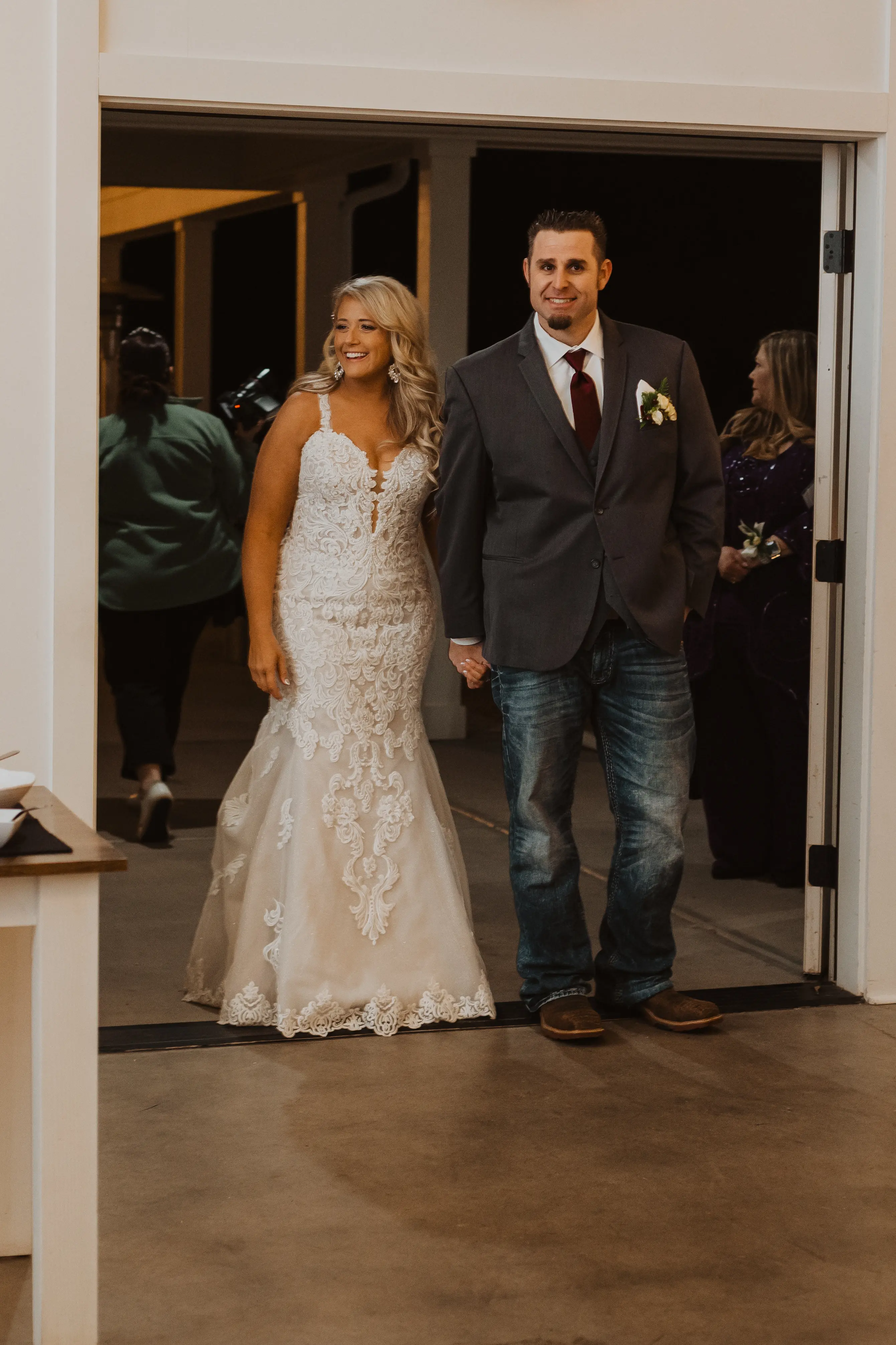 Groom Walking Into Reception With Bride In A Sparkly Lace Fit-And-Flare Wedding Dress Named Fiona By Maggie Sottero