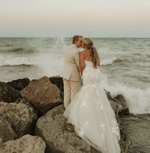 Bride wearing Hattie wedding dress by Rebecca Ingram with her husband