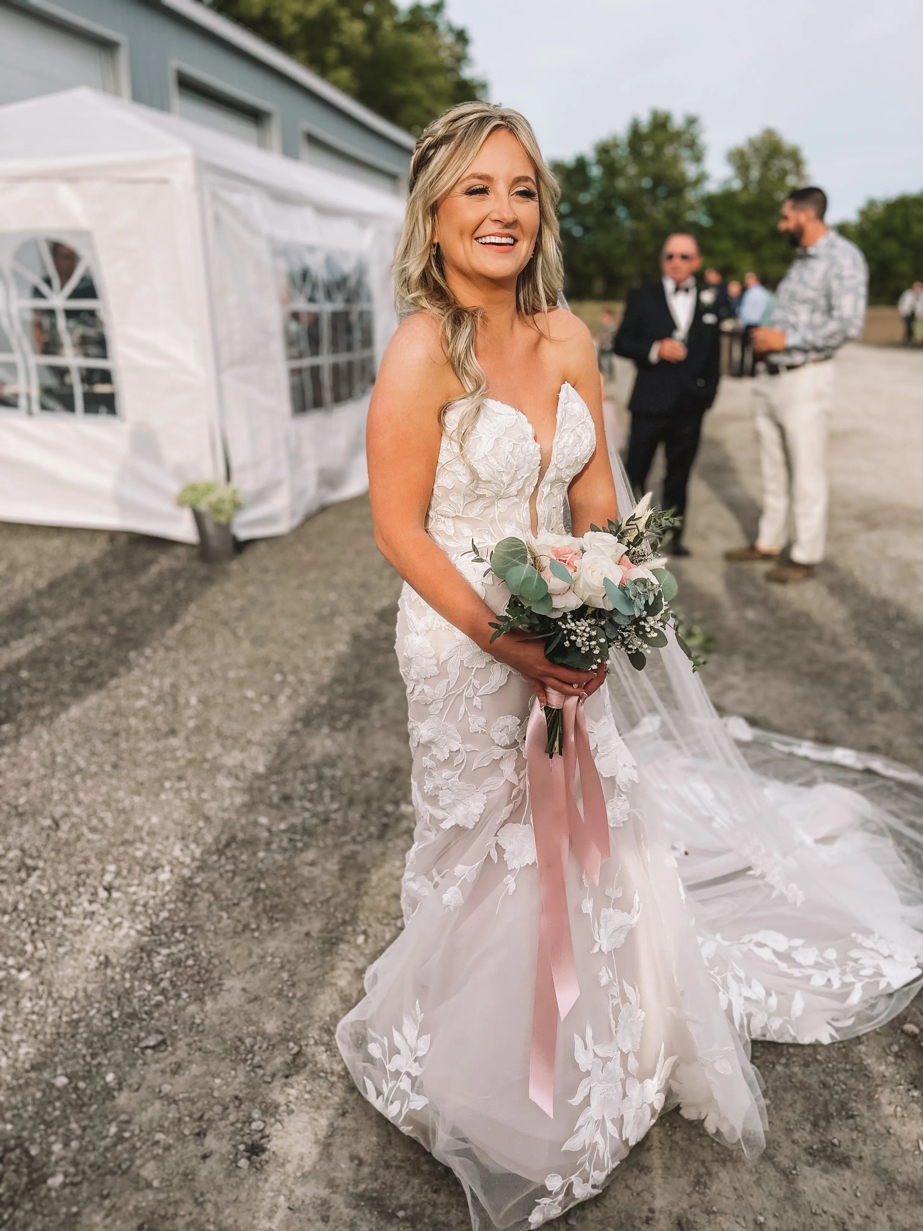 Bride in strapless lace wedding dress called Hattie by Rebecca Ingram