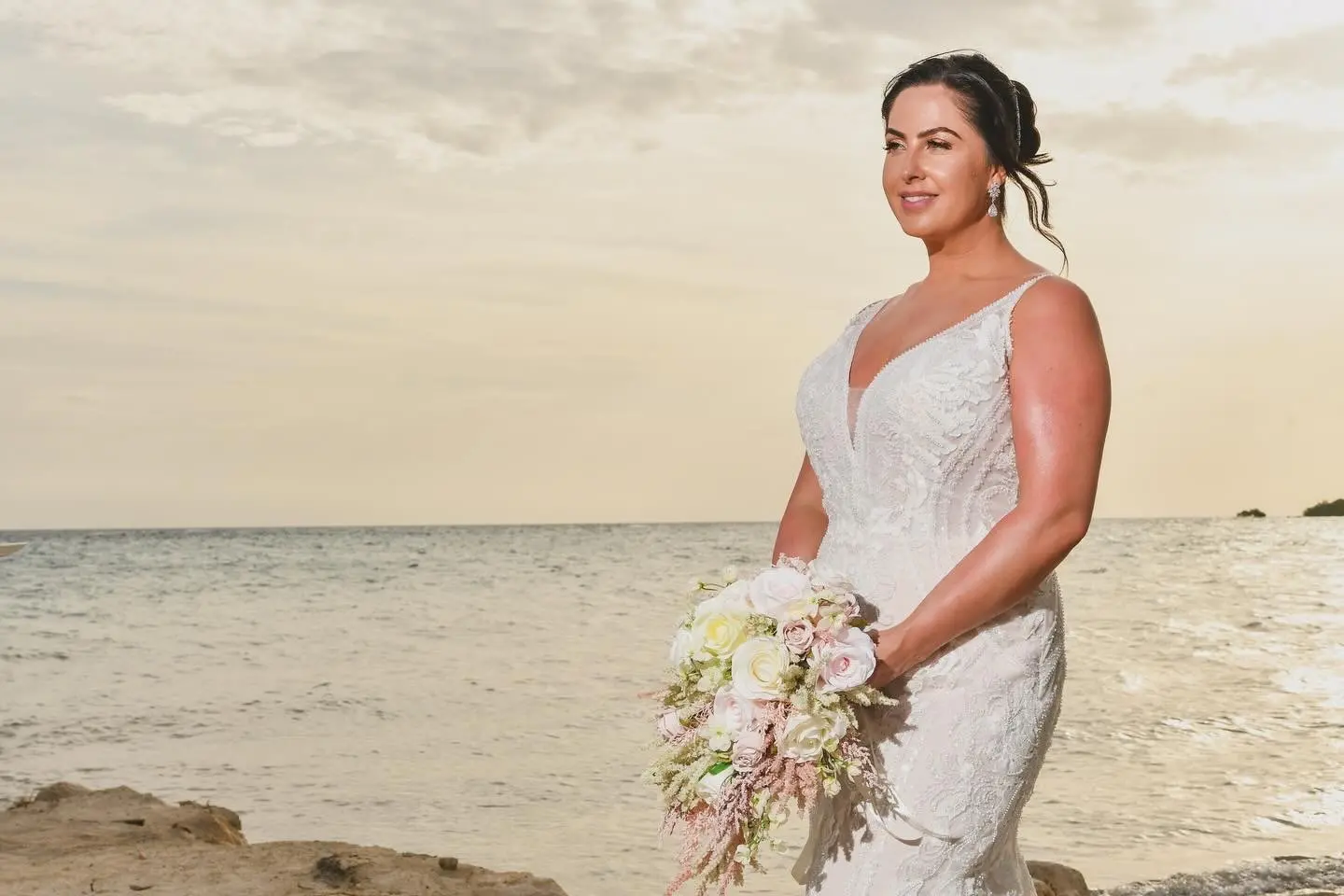 Bride wearing Franklynn by Sottero and Midgley at the beach