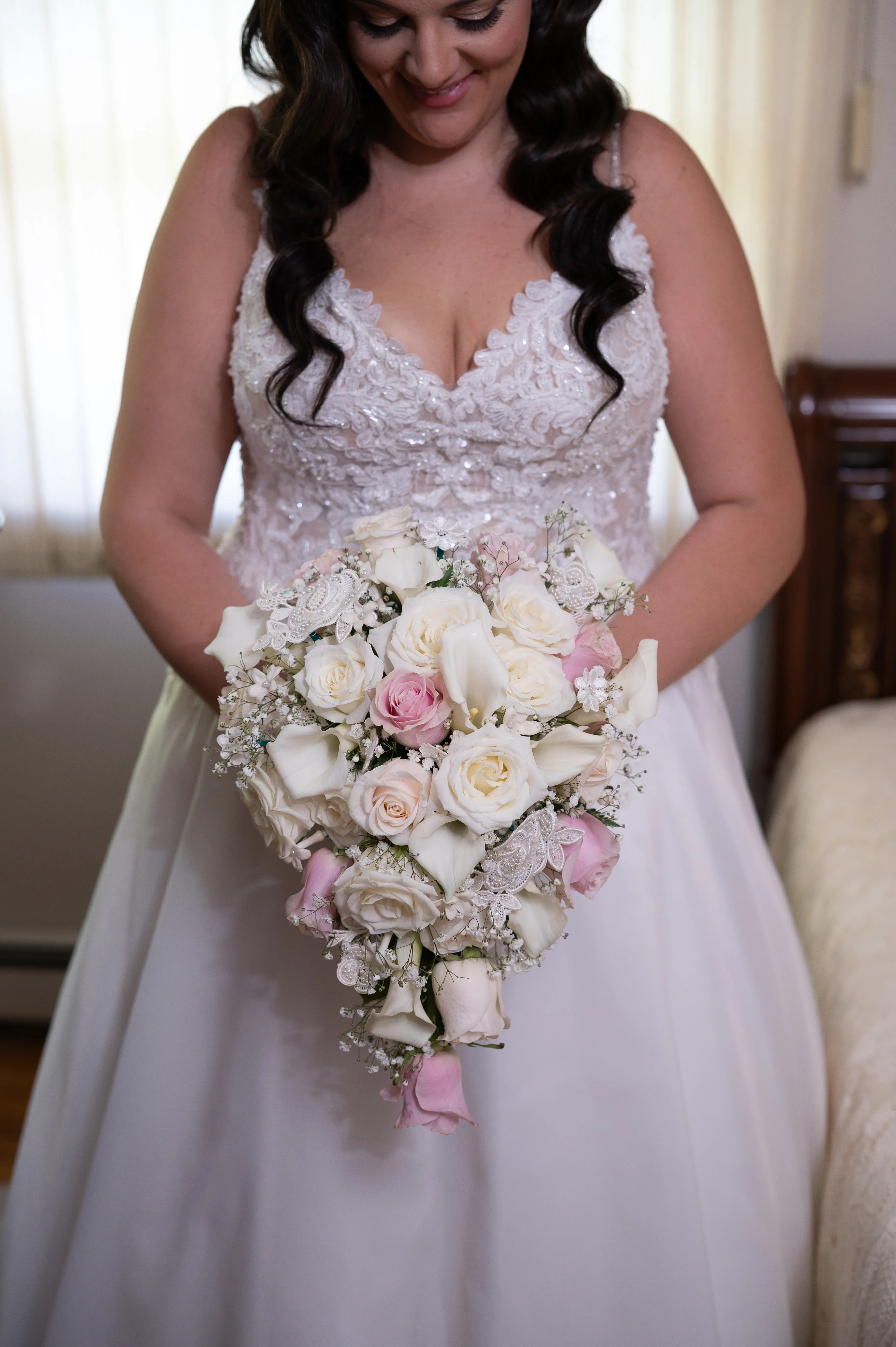 Bride In A-line Wedding Dress Named Savannah By Maggie Sottero Bride Holding Flowers
