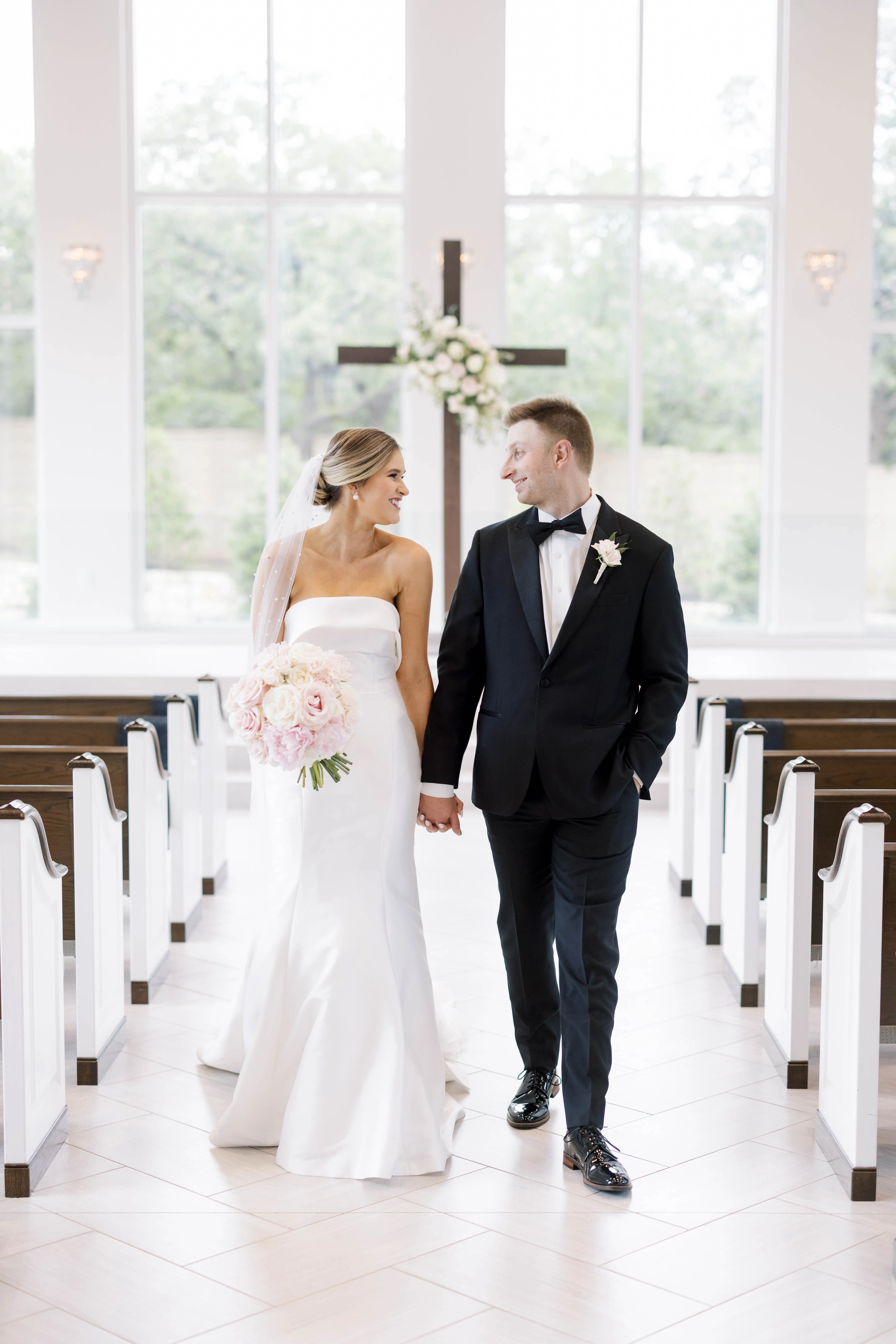 Groom With Bride Wearing Simple Sheath Wedding Dress With Bow Back Called Mitchell By Maggie Sottero