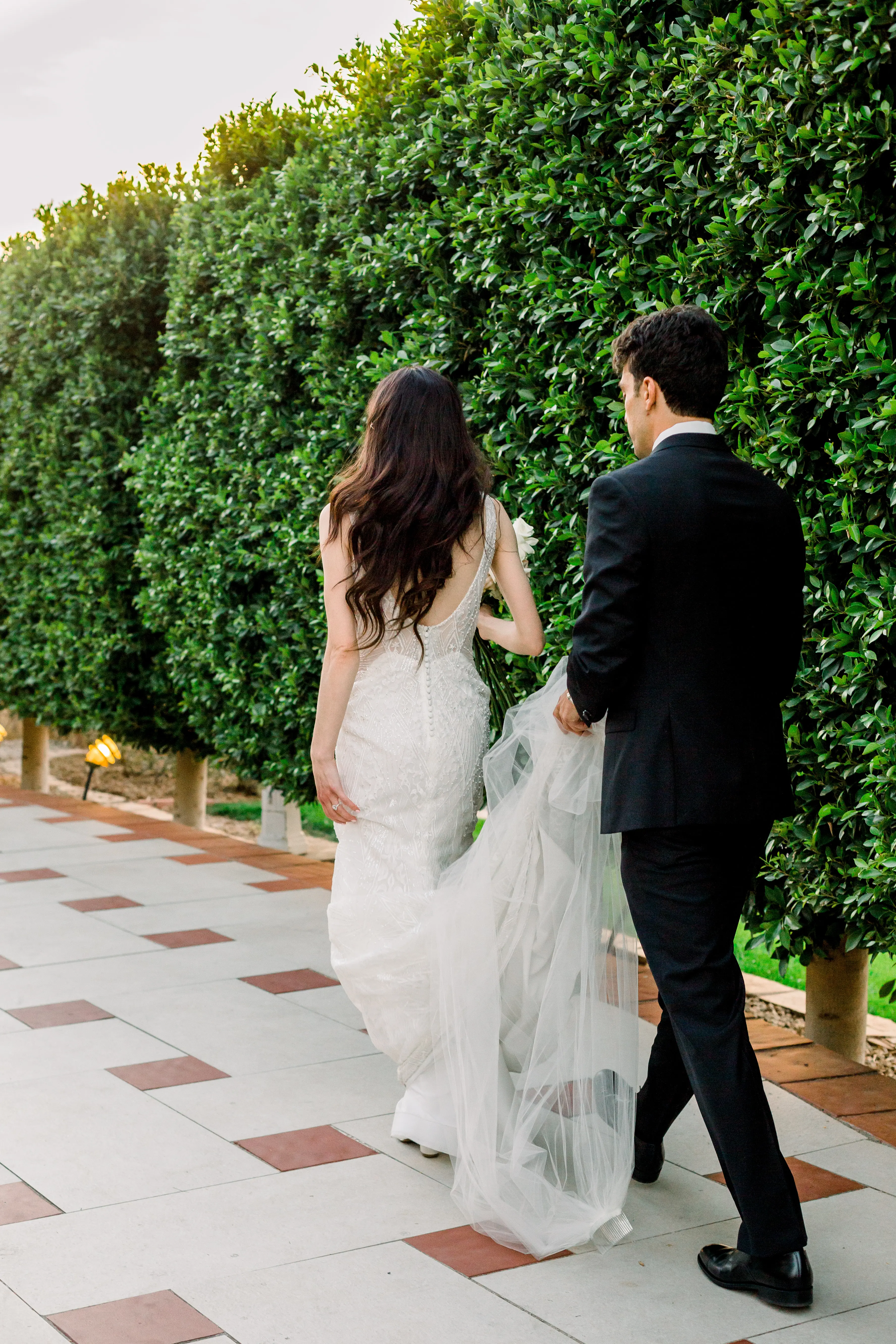 Bride Wearing Vintage Art Deco Wedding Dress Called Elaine By Maggie Sottero Grooms Holding Train