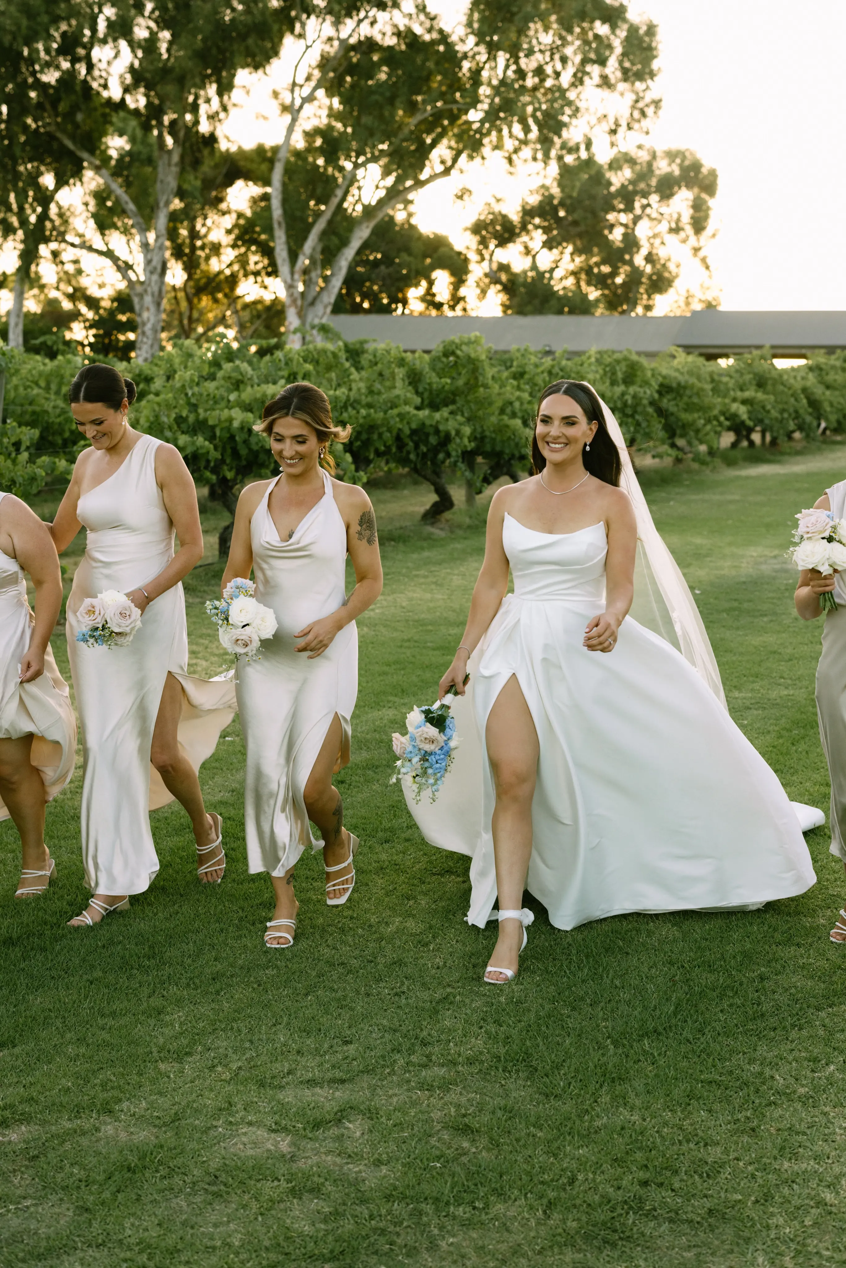 Bride wearing Aspen by Sottero and Midgley walking with her bridesmaids