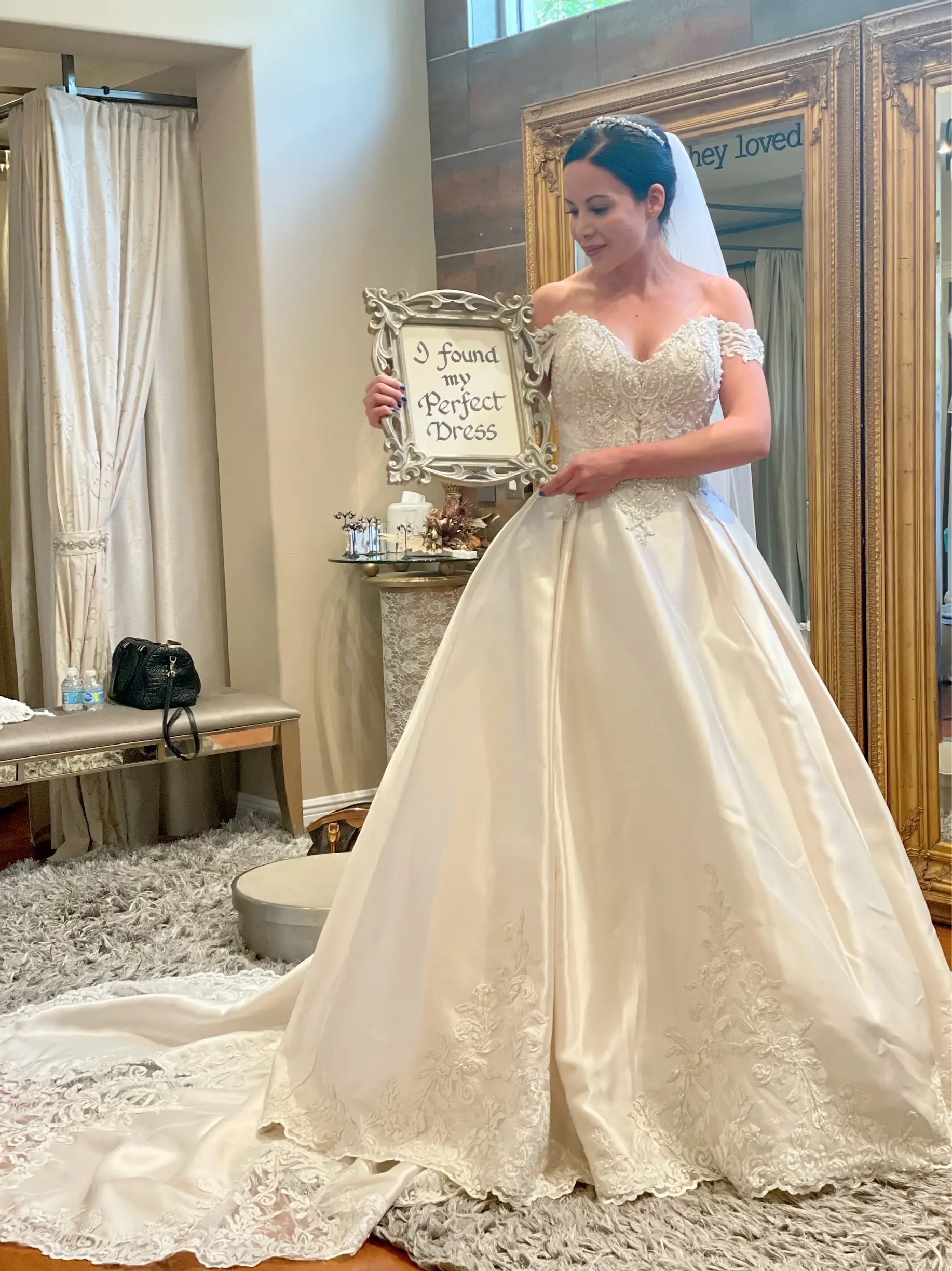 Bride wearing elegant satin ballgown called Kimora by Sottero and Midgley