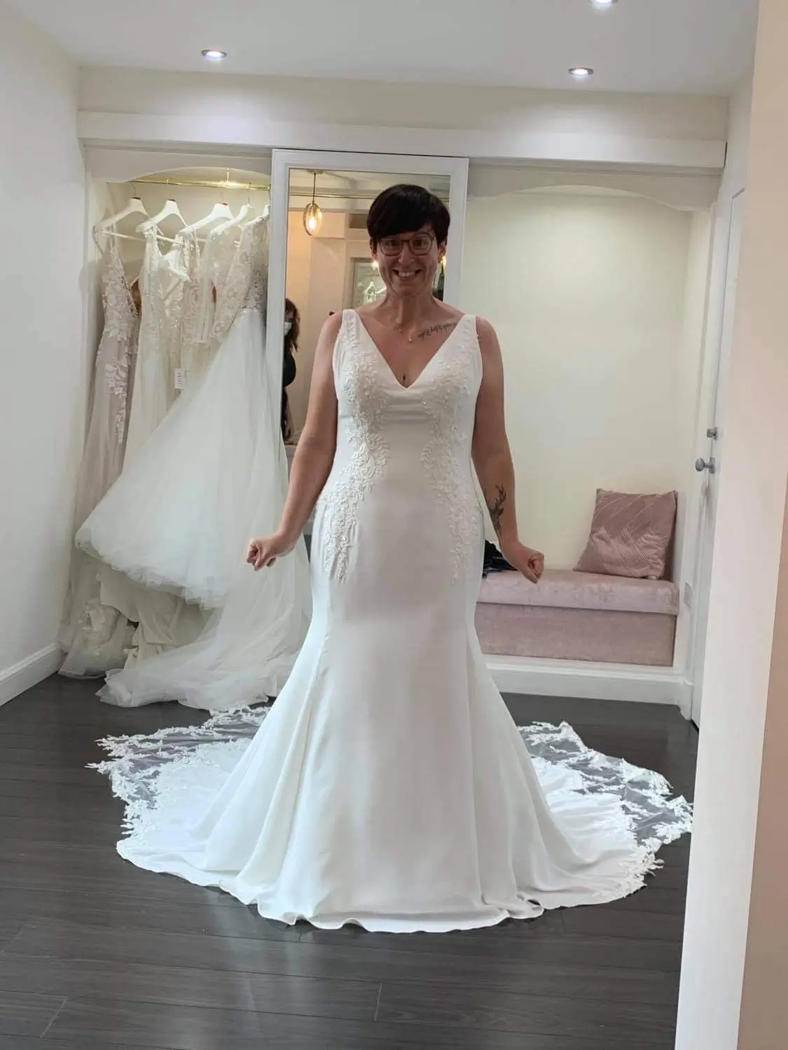 Bride in wedding dress called Adrianna in bridal boutique.