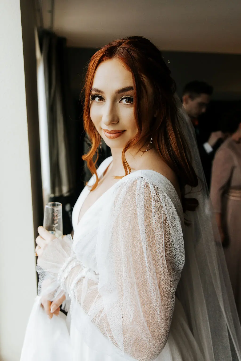 Bride Wearing Sexy Long Sleeve A-Line Wedding Dress Indoors.