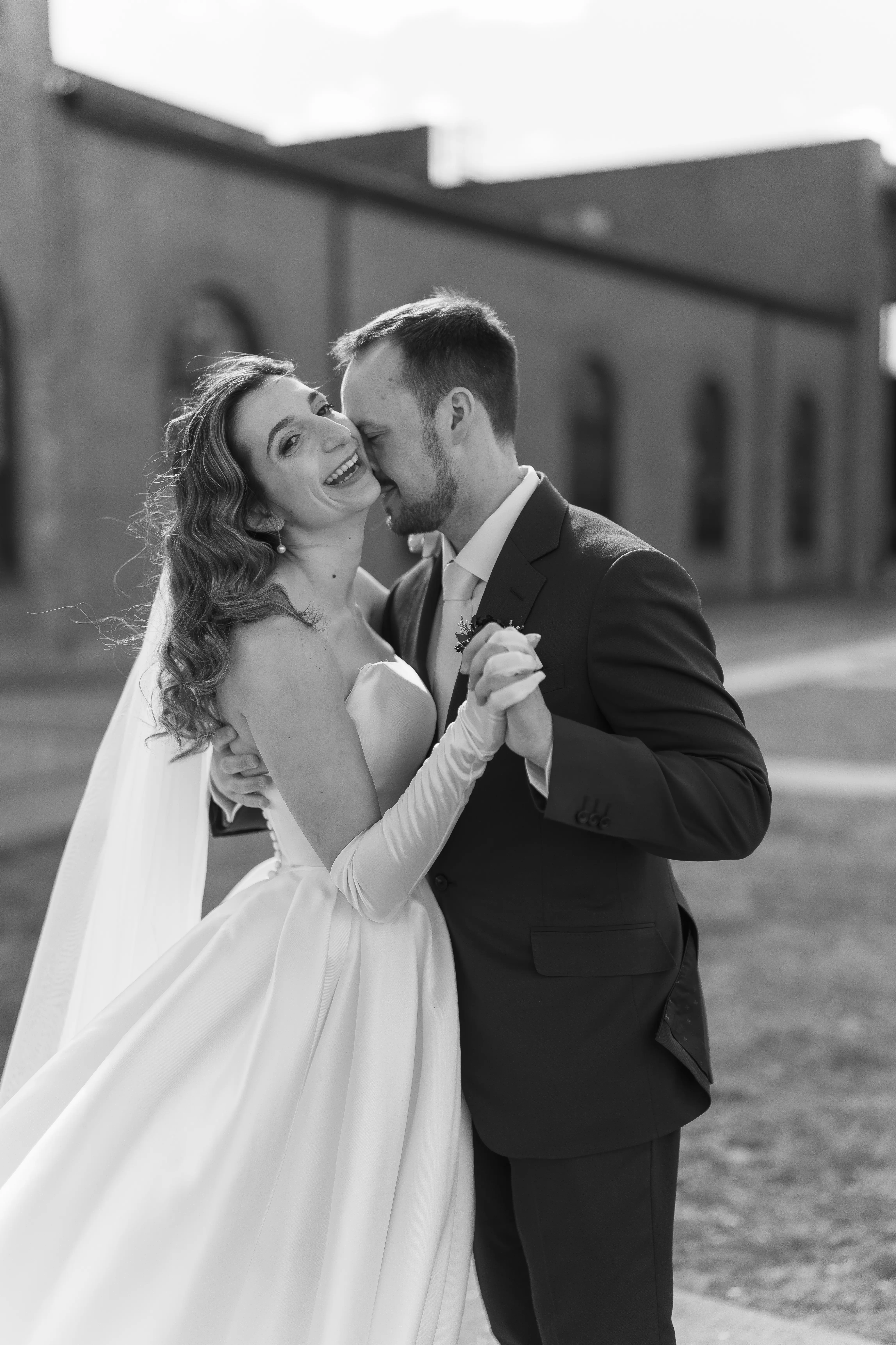 Bride wearing Selena by Maggie Sottero dancing with her husband