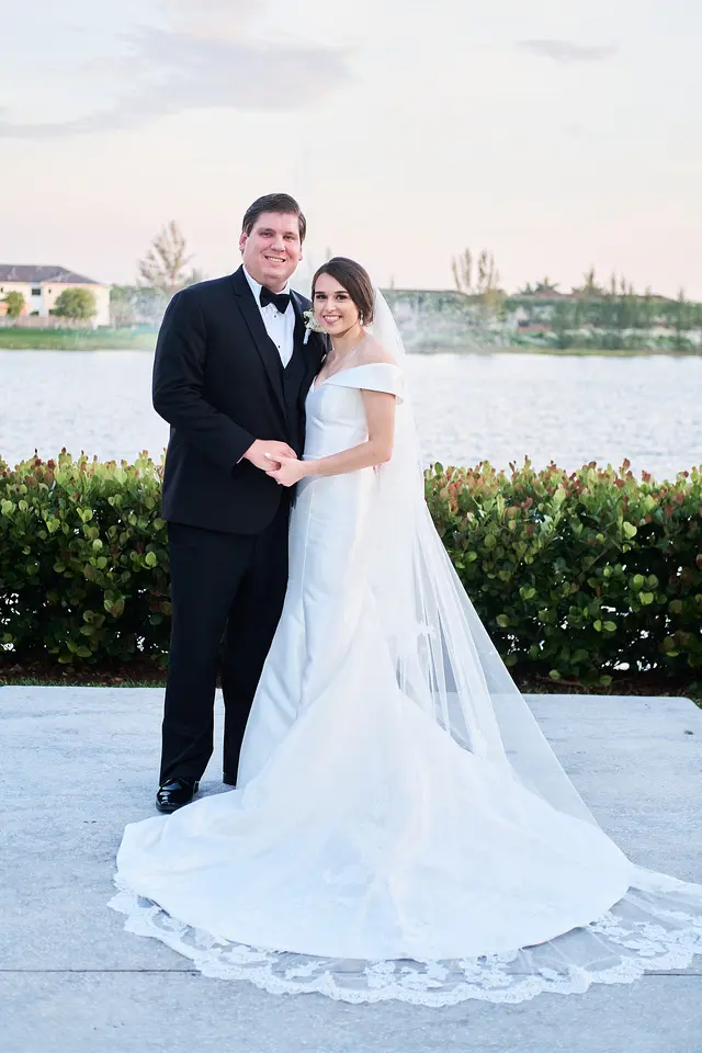 bride with groom in off the shoulder elegant wedding dress