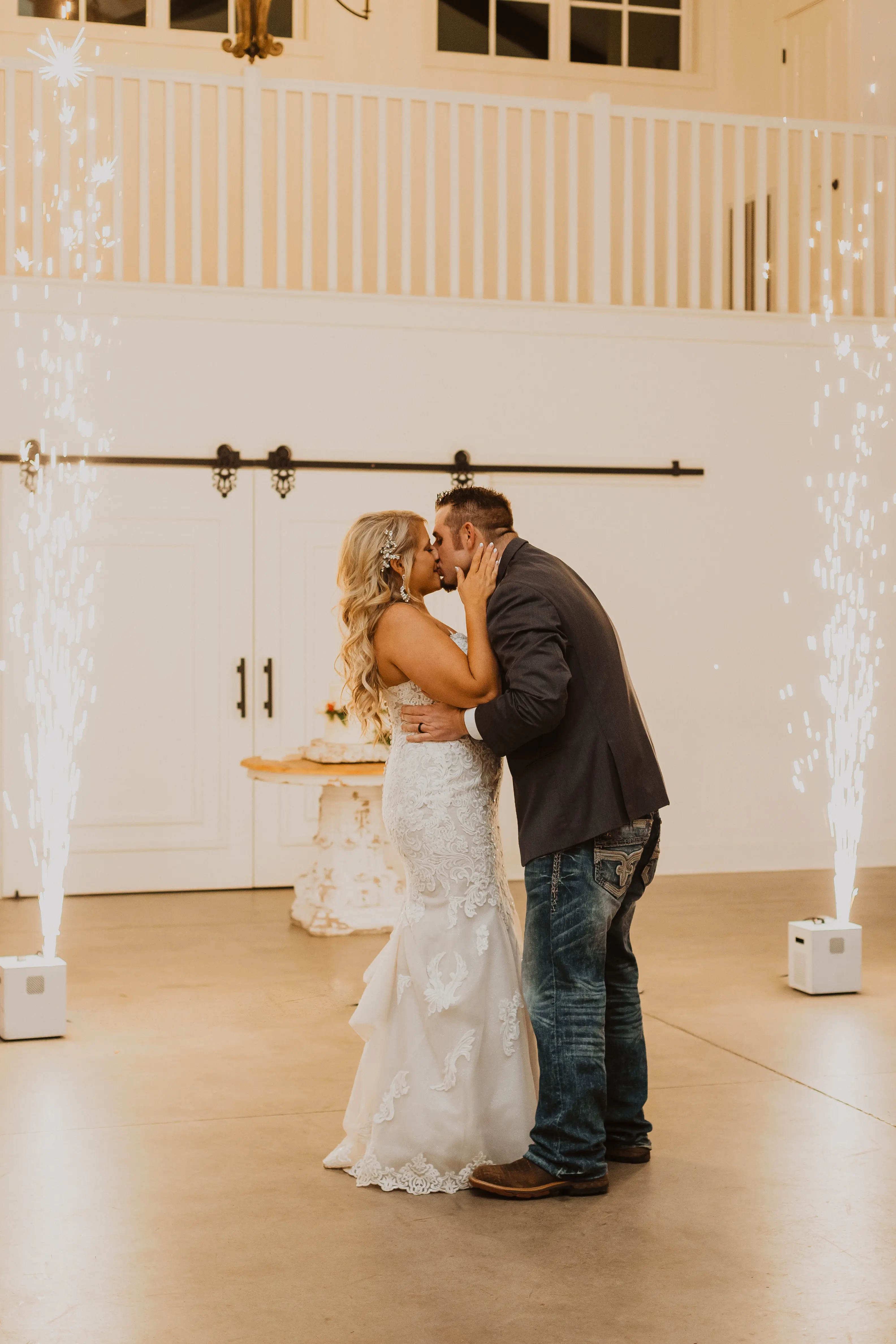 Groom Kissing Bride In A Sparkly Lace Fit-And-Flare Wedding Dress Named Fiona By Maggie Sottero