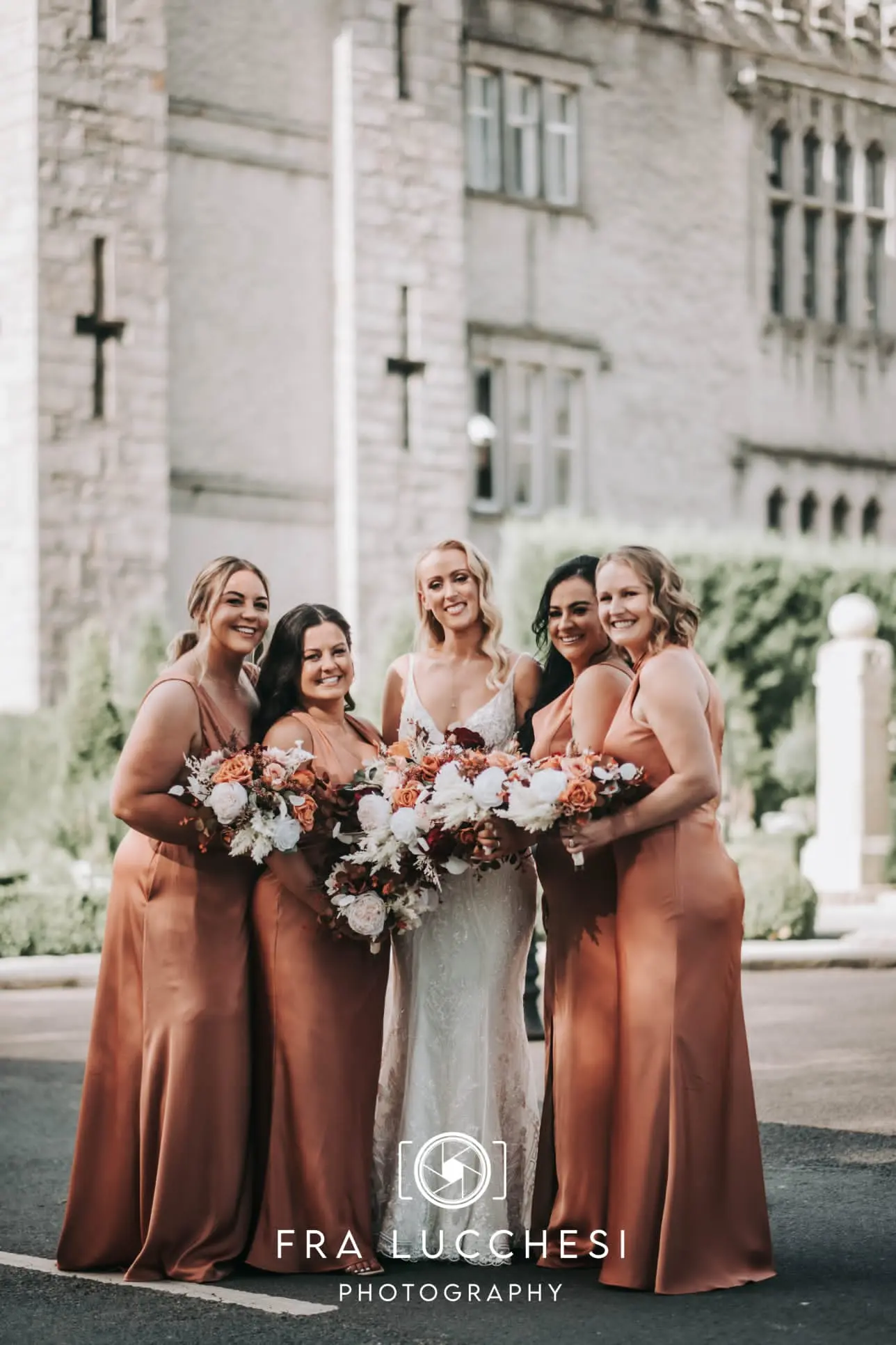 Bride wearing Bailey wedding dress by Sottero and Midgley with her bridesmaids