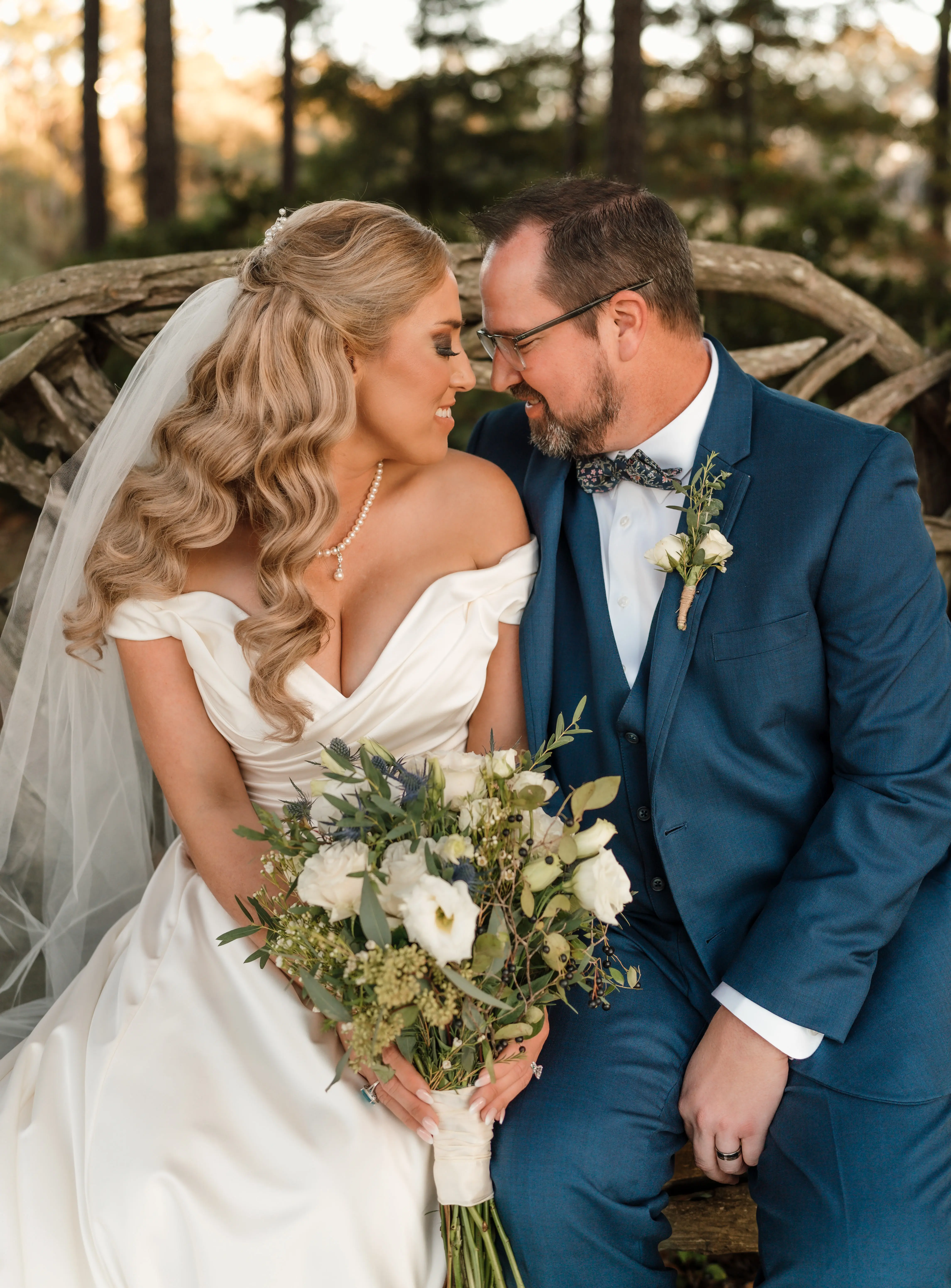 Bride wearing Ekaterina wedding dress by Maggie Sottero looking at her husband