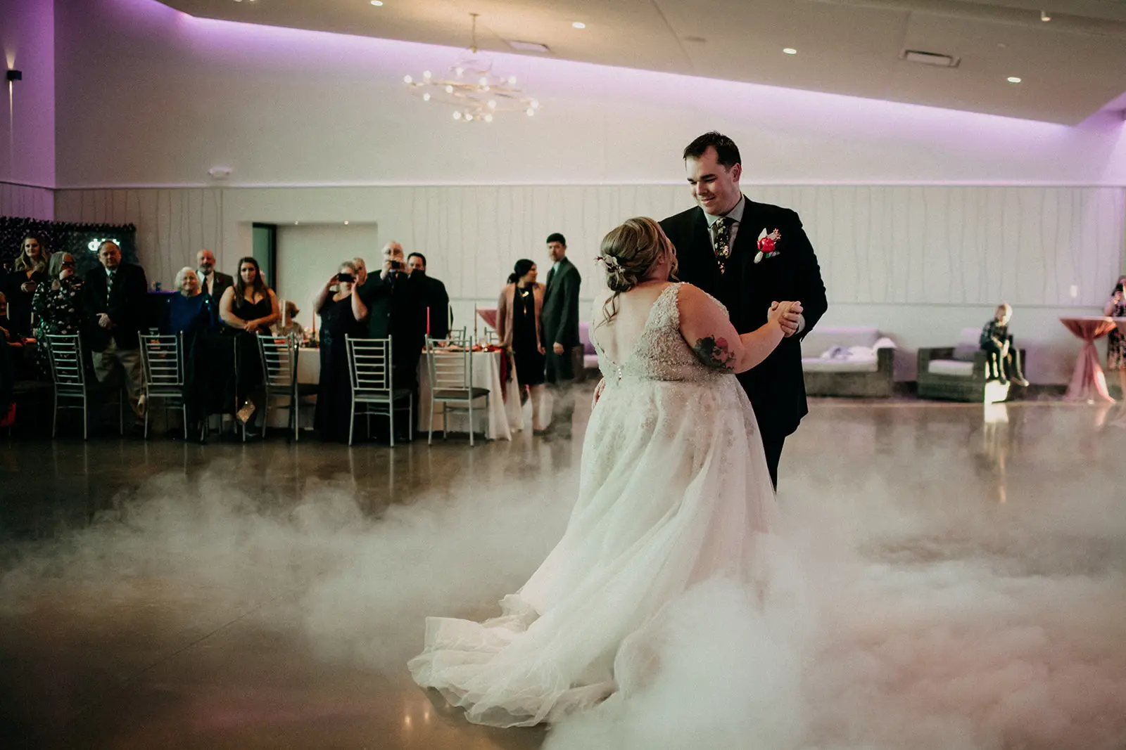 Groom Dancing with Bride in Ball Gown Wedding Dress Named Talia By Maggie Sottero