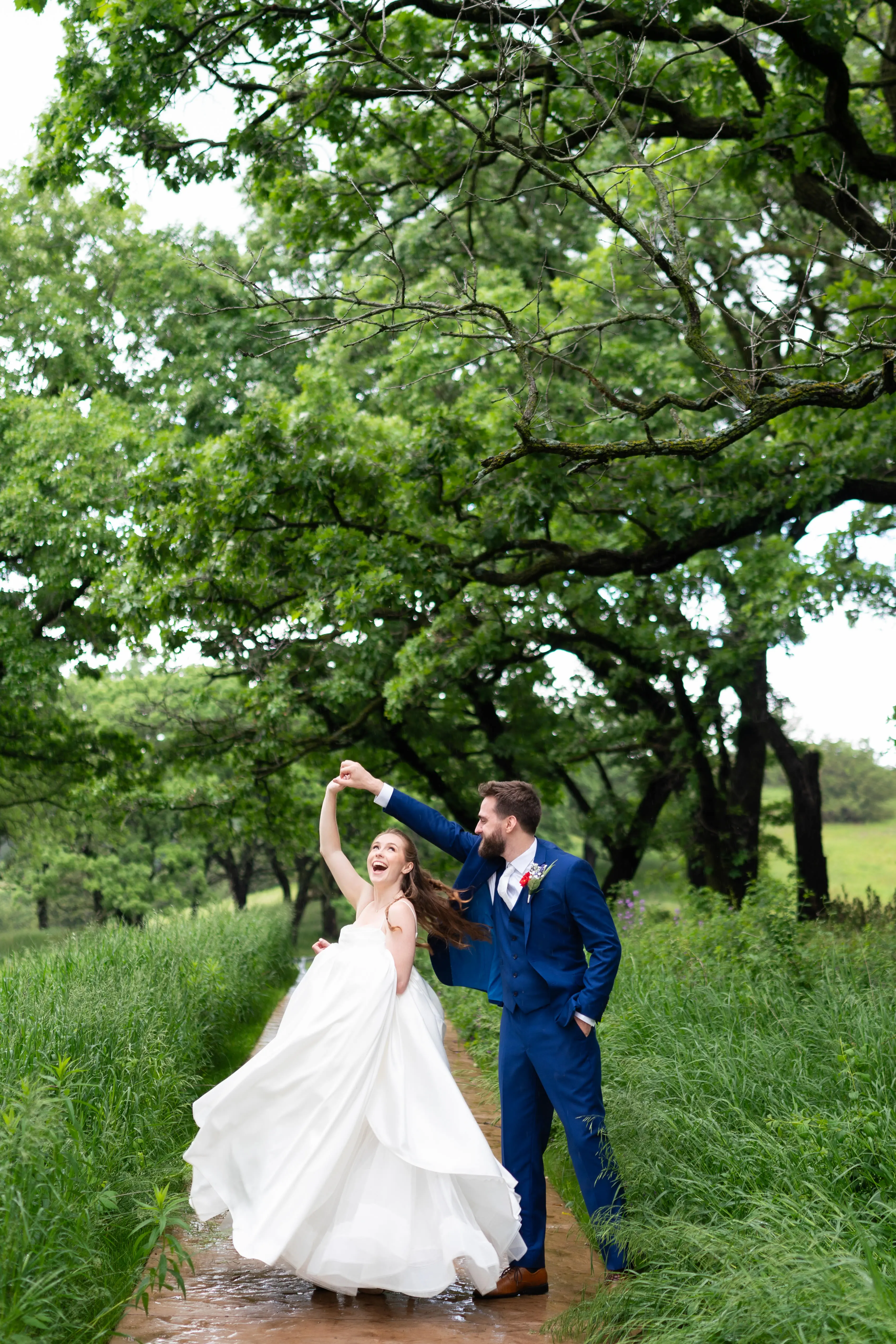 Bride wearing Scarlet by Maggie Sottero dancing with her husband