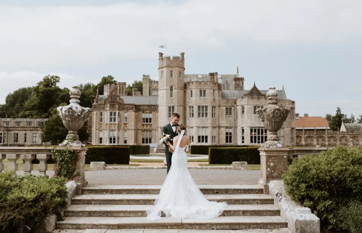 Groom With Bride Wearing Strapless Mermaid Wedding Dress With Oversized Lace Hattie By Rebecca Ingram