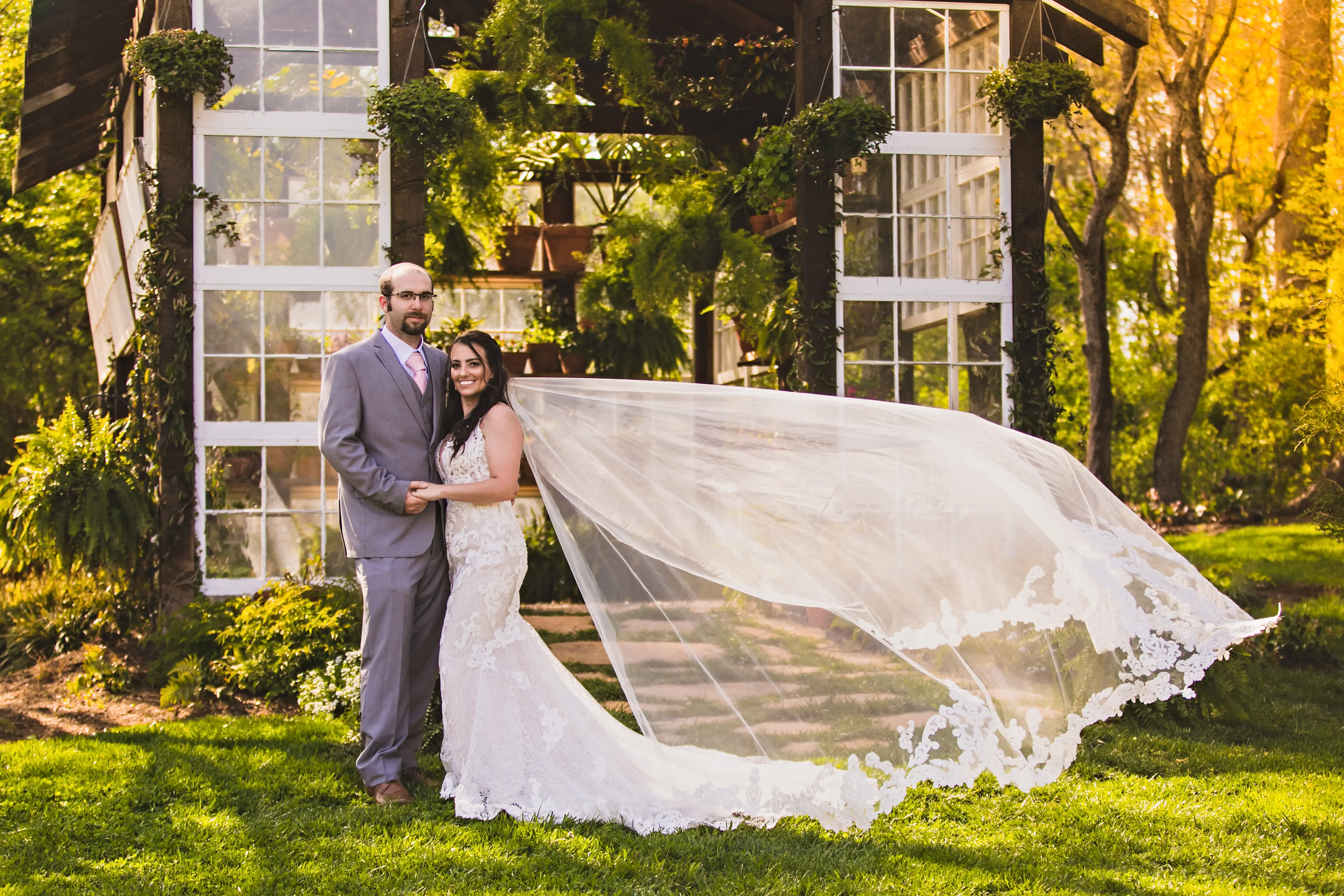 Groom with Bride in Shimmering Lace Motif Wedding Gown with Plunging Sweetheart Neckline Called Tuscany Lynette by Maggie Sottero