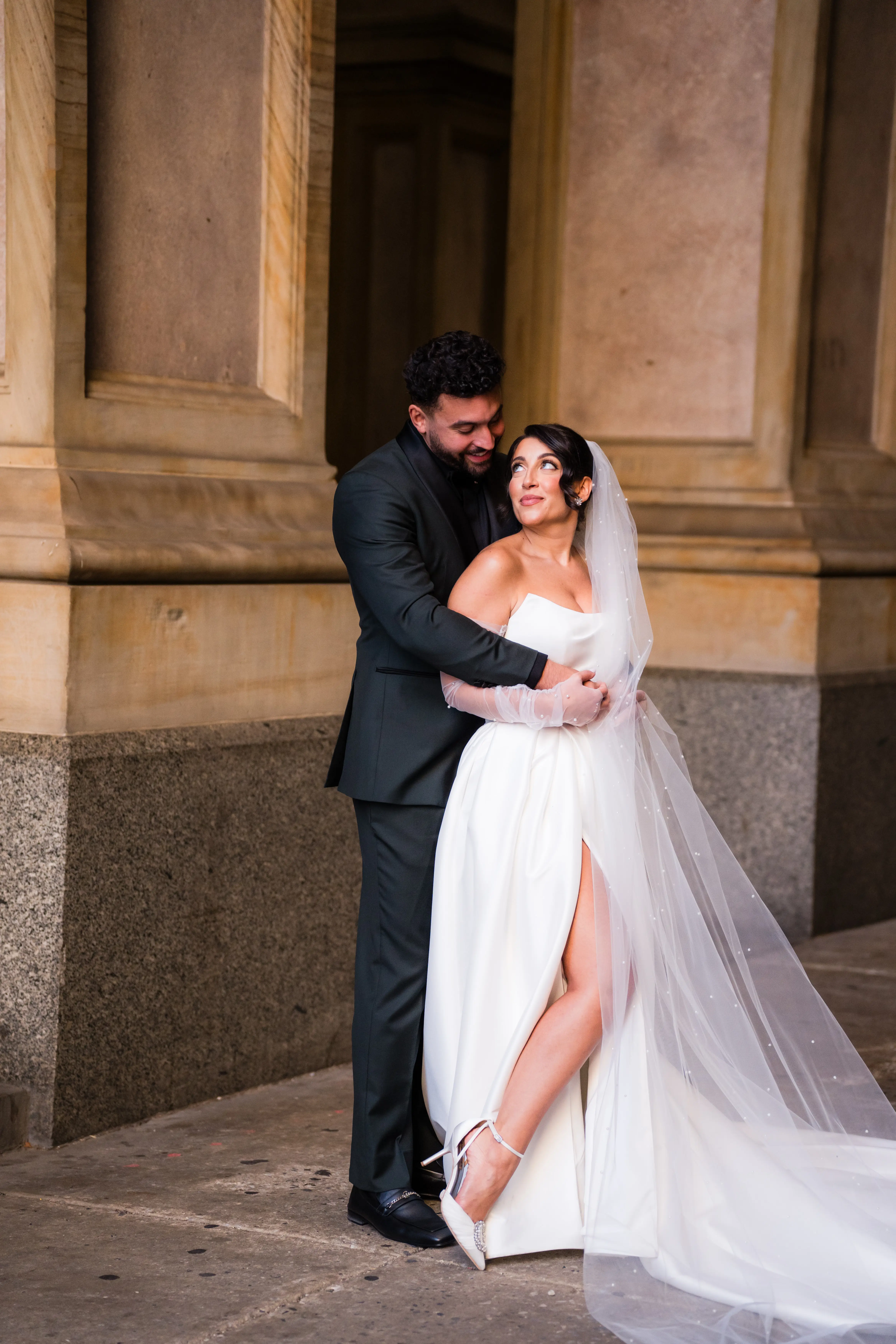 Groom Holding Bride Wearing Modern Ballgown Wedding Dress Called Aspen By Sottero And Midgley