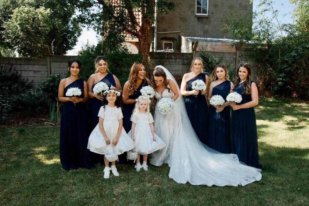 Bride Wearing Boho Lace Wedding Dress Called Roxanne By Sottero And Midgley With Her Bridesmaids And Flowergirls