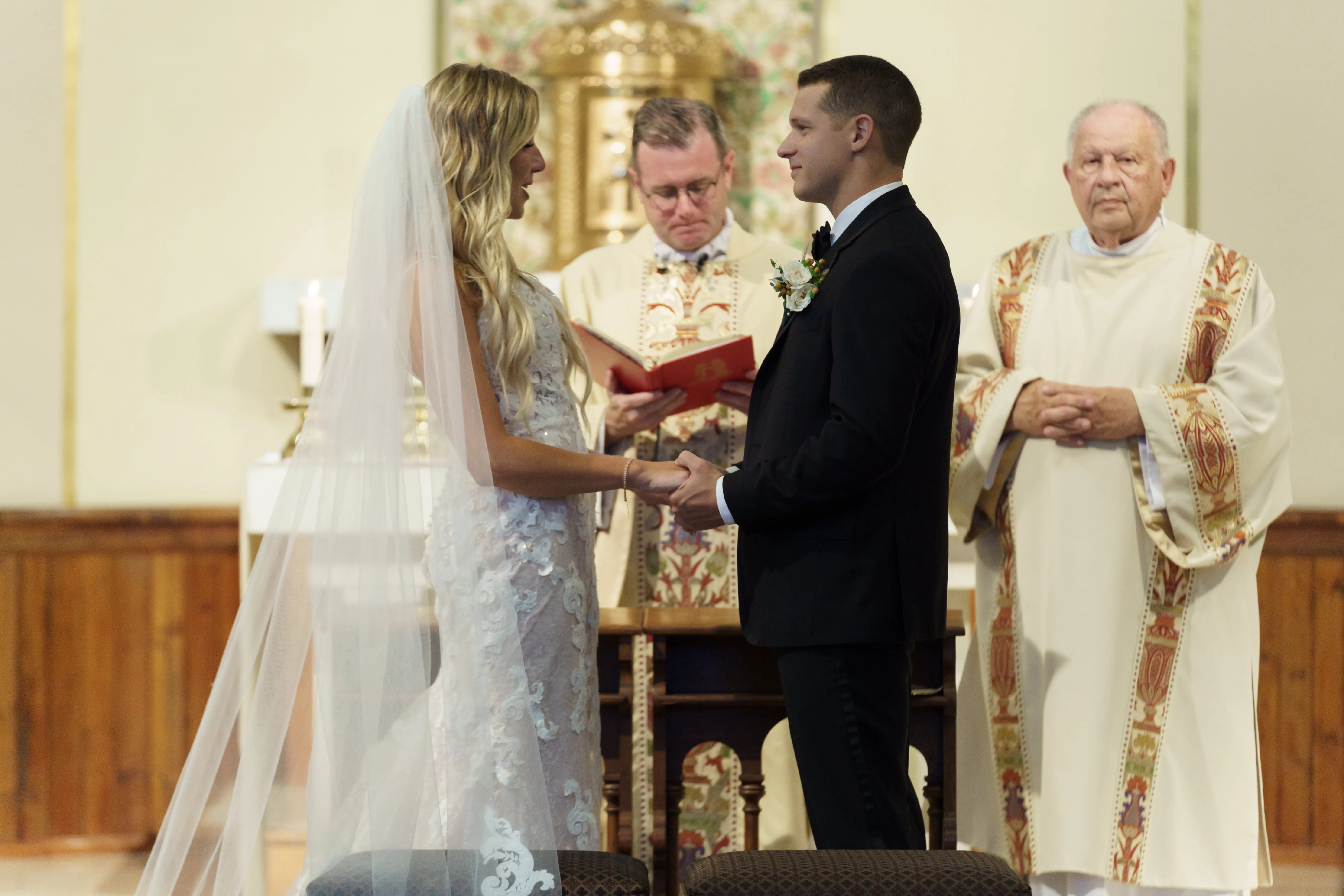Bride wearing Lace Sheath Wedding Dress called Tuscany Lynette by Maggie Sottero and groom at the altar