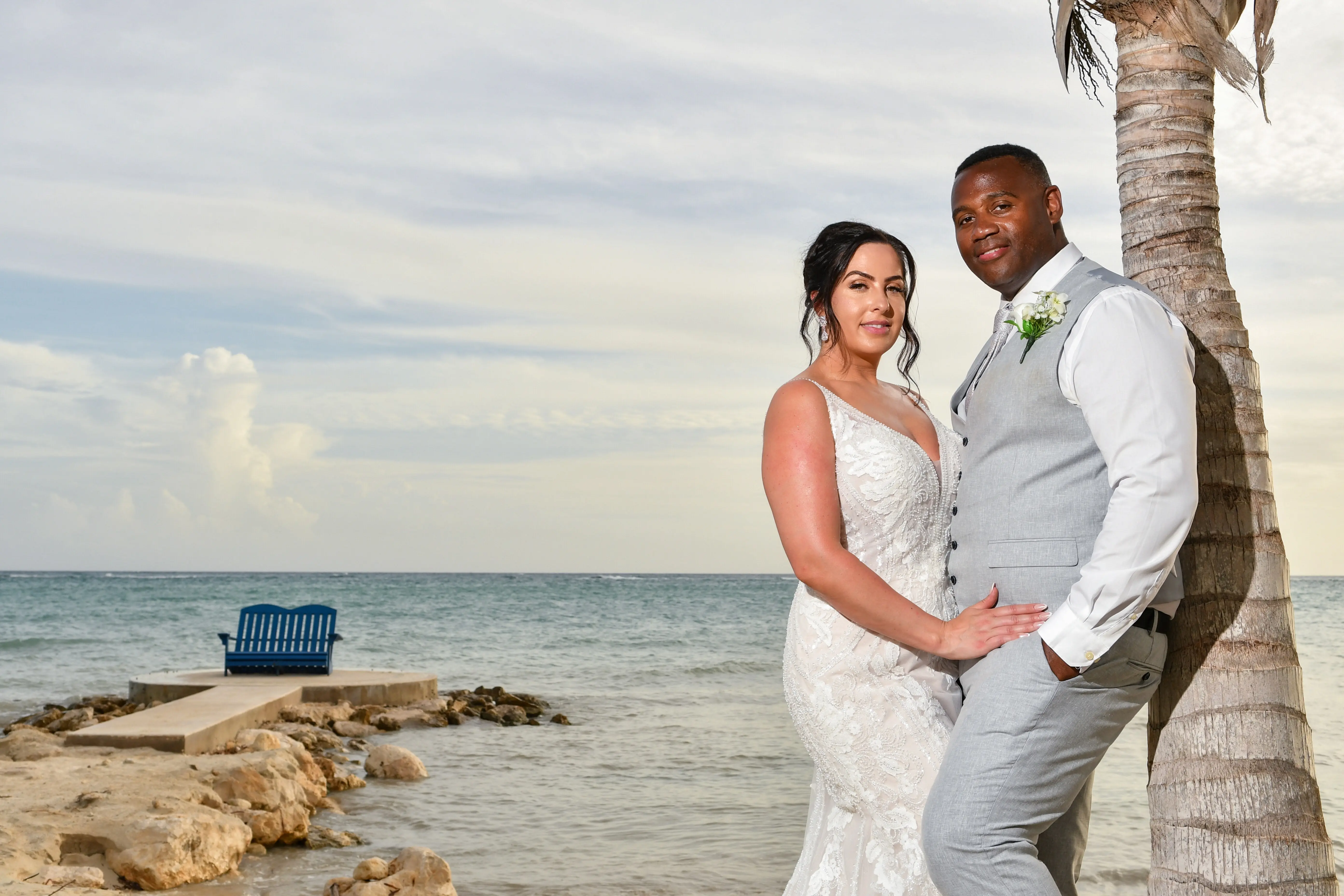 Bride wearing Franklynn by Sottero and Midgley with her husband on the beach