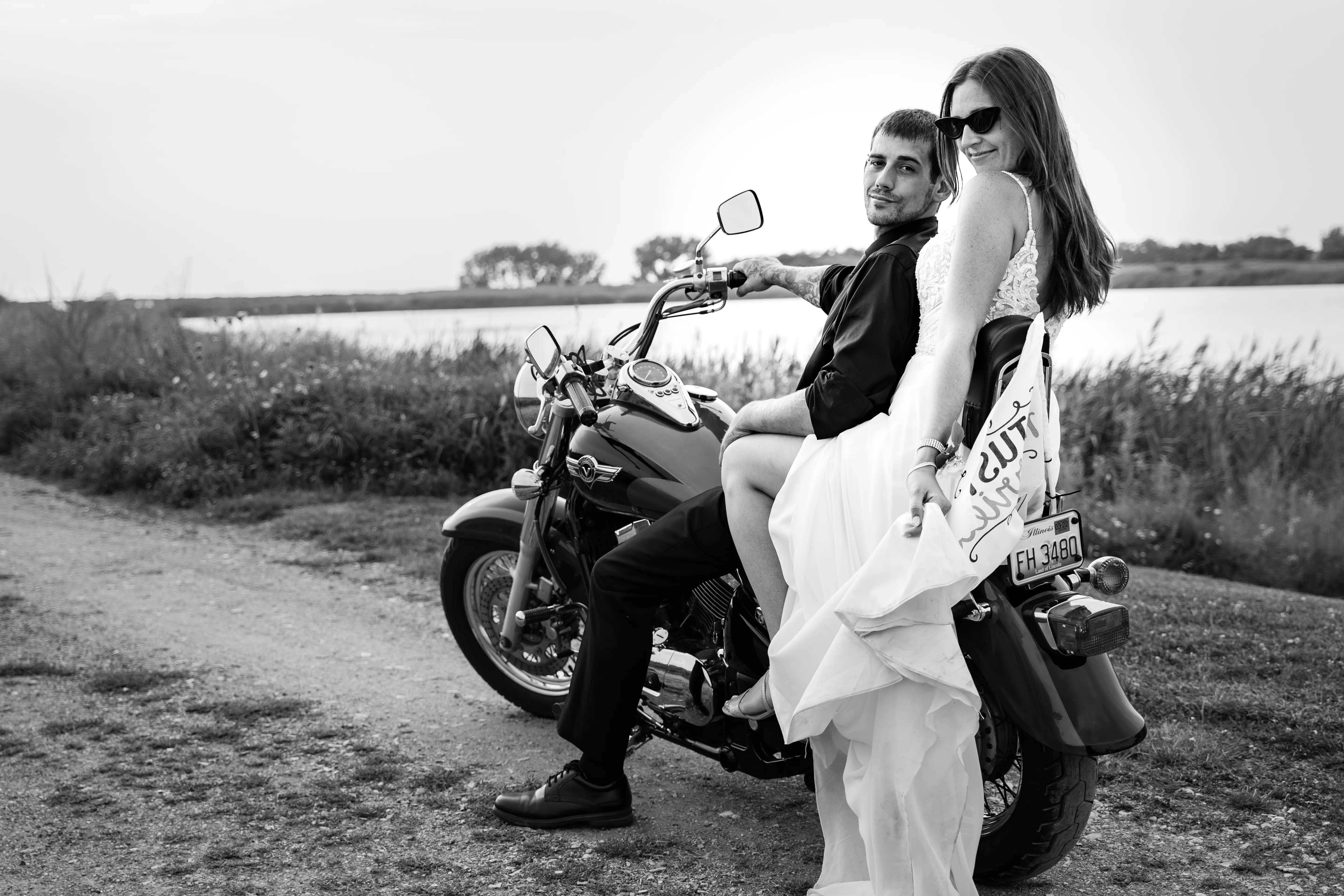 Bride Wearing Beach Sheath Wedding Dress Called Lorraine By Rebecca Ingram On A Motorcycle With Groom