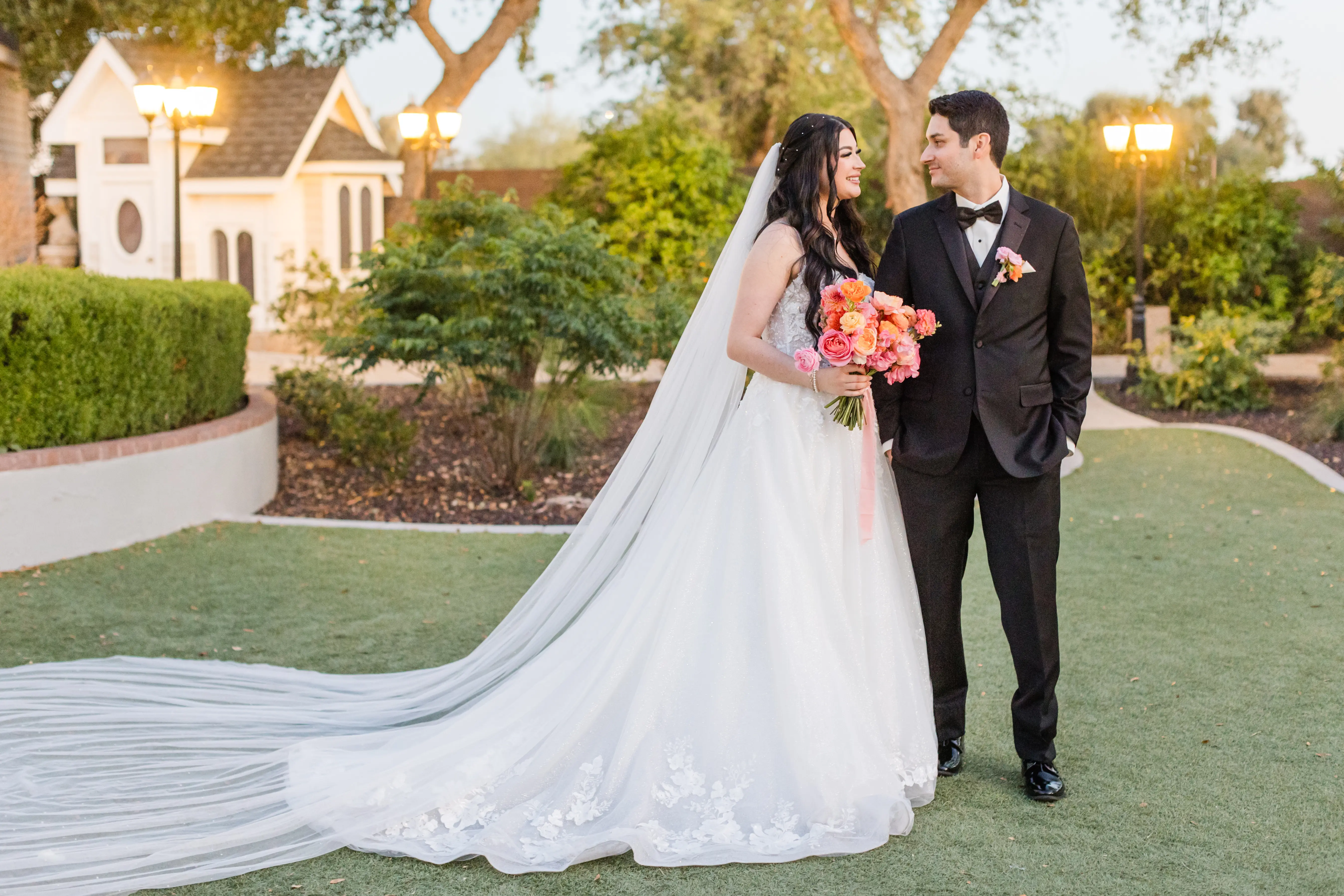 Bride wearing Casey by Maggie Sottero smiling at her husband
