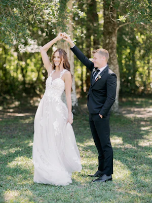 Bride Wearing Plunging V-Neckline Bridal Dress Named Hattie Lane Marie By Rebecca Ingram Bride Dancing With Groom