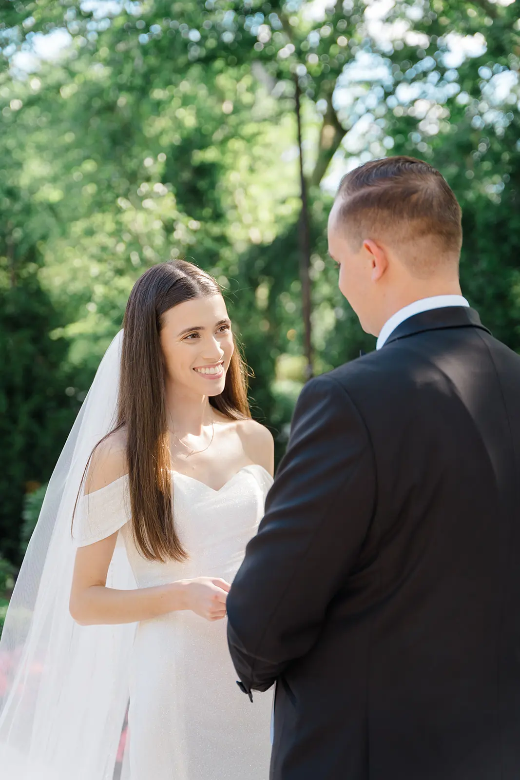Bride wearing Anniston Lane by Maggie Sottero looking at her husband