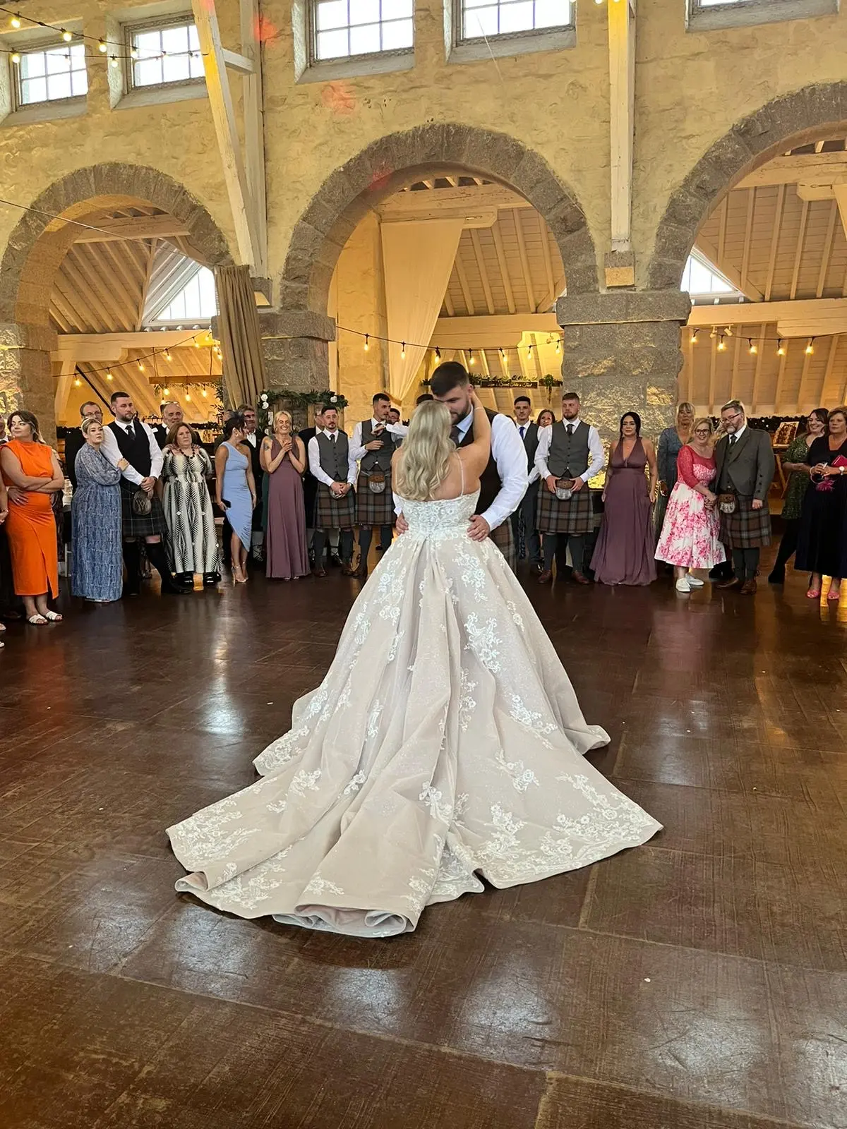 Bride wearing Norvinia by Sottero and Midgley dancing with her husband