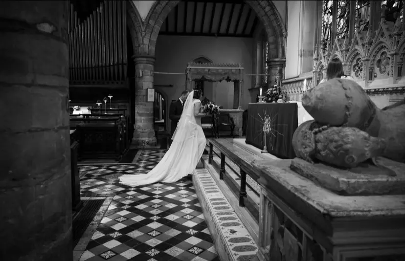 Bride Wearing Chiffon Lace Wedding Dress Called June By Maggie Sottero Walking Up The Steps