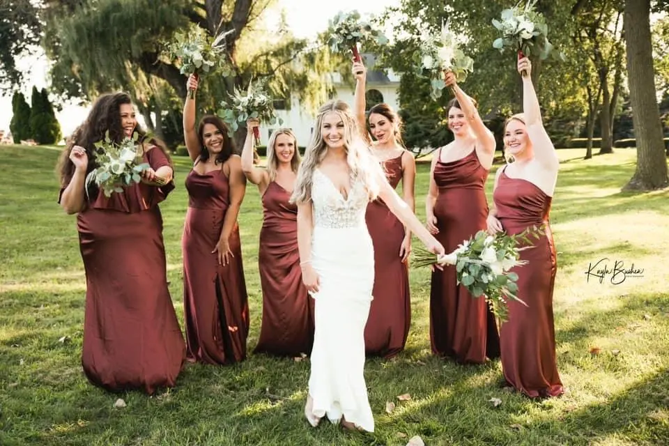 Bride with groom wearing sexy v back sheath wedding dress