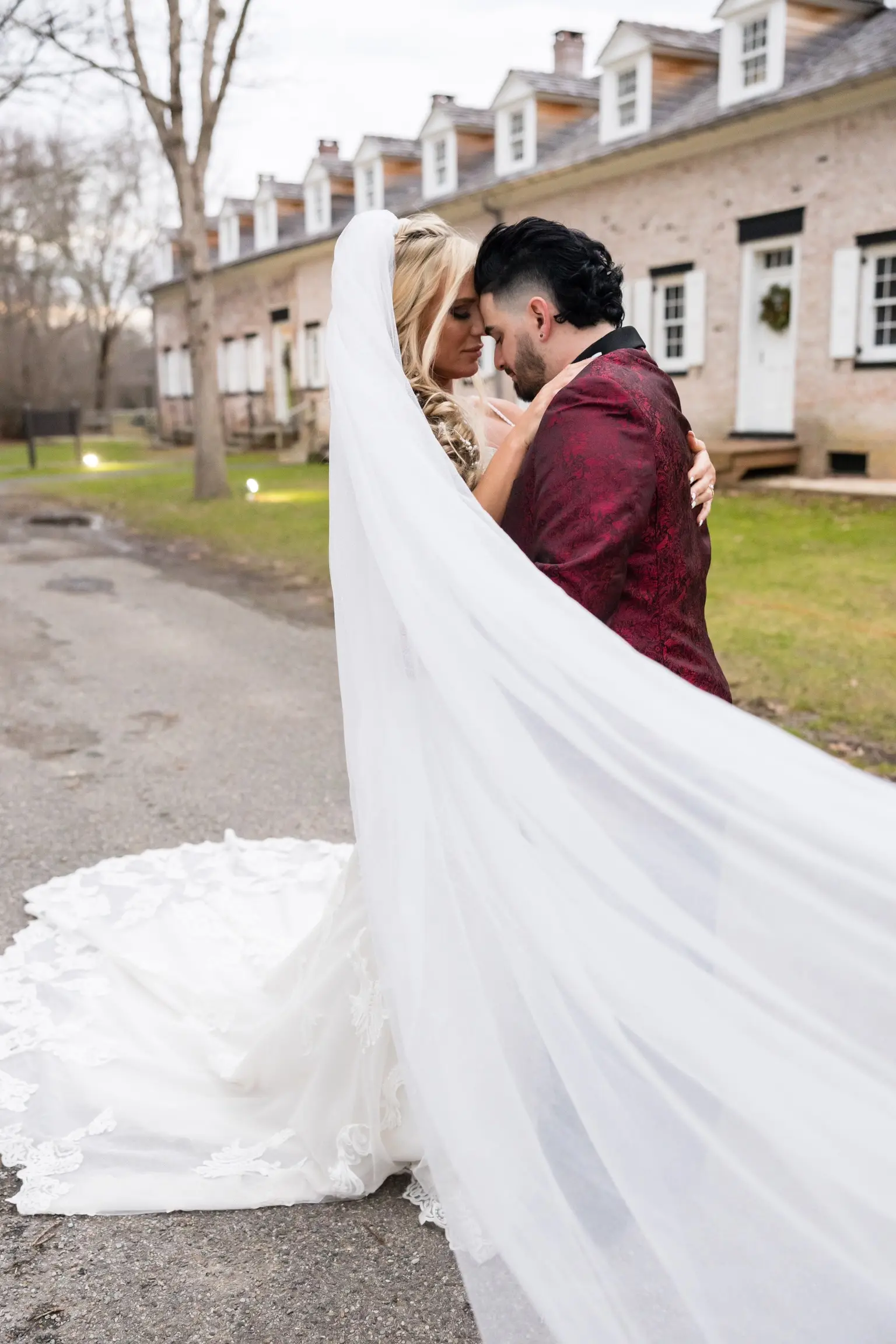 Bride In Lace Off The Shoulder Wedding Dresses Called Fiona By Maggie Sottero With Groom