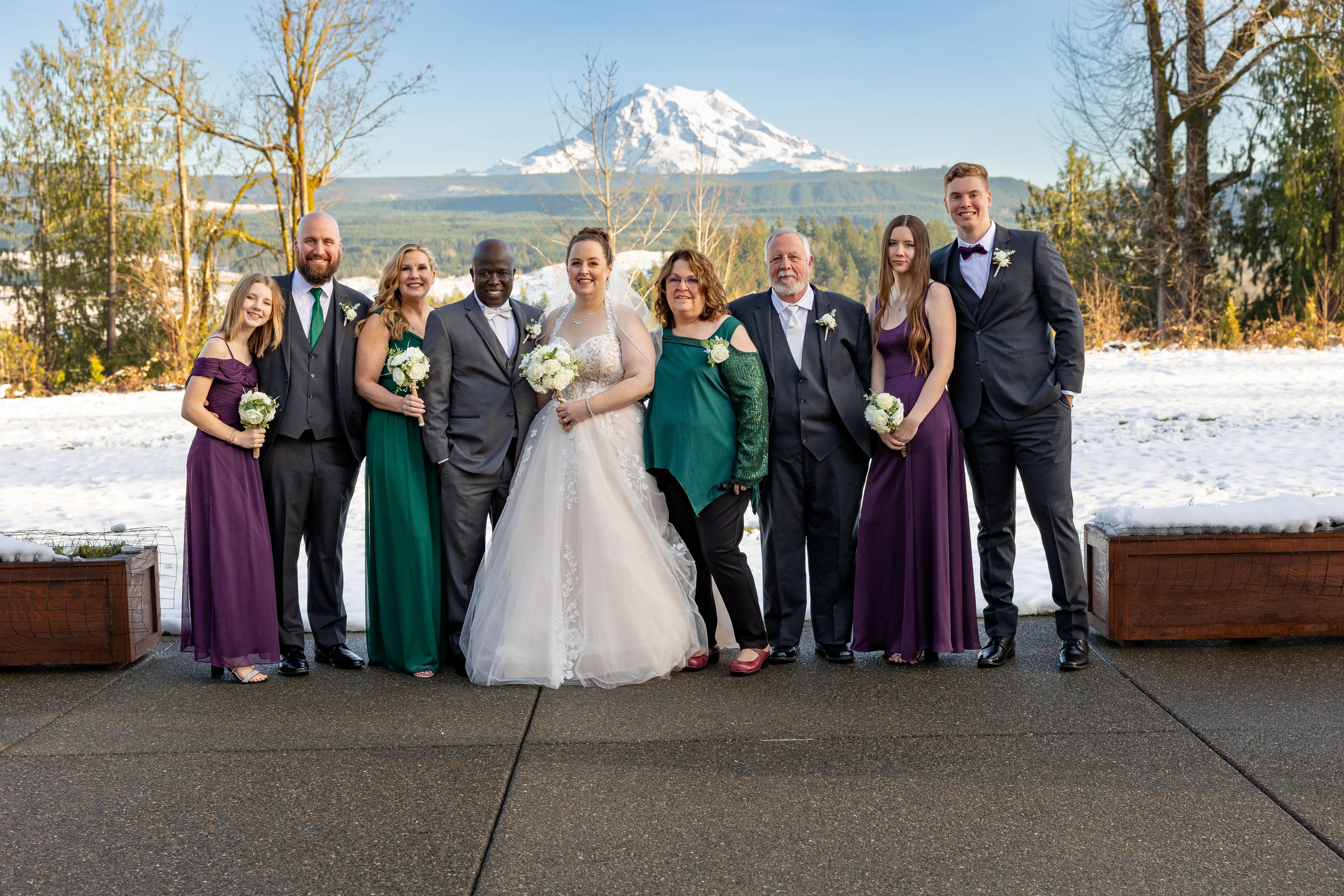 Bride In Ballgown Wedding Dress Called Harlem By Maggie Sottero With Groom With Bridal Party In Green And Purple