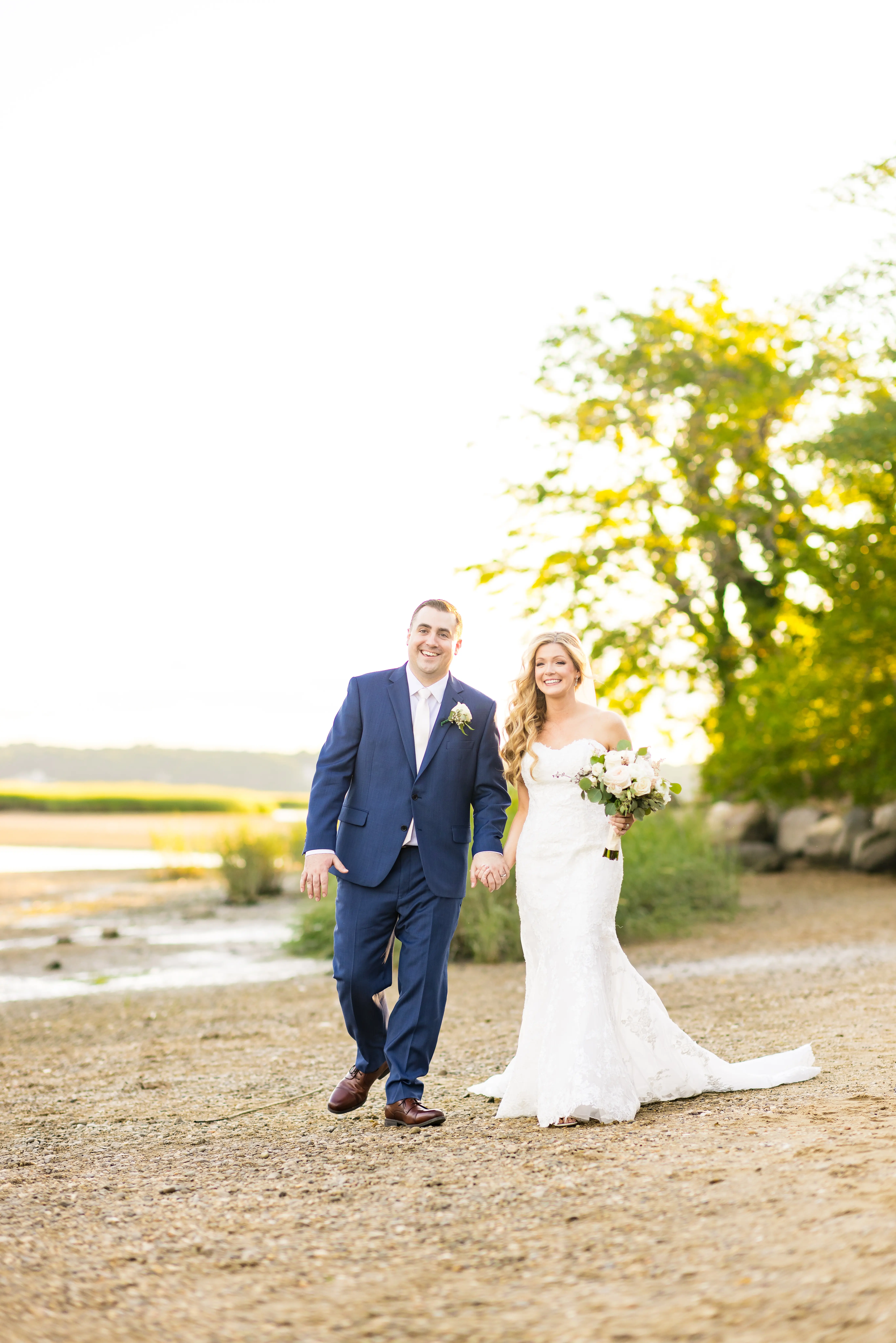 Bride Wearing 3-D Flower Fit-And-Flare Bridal Gown Named Ryker by Sottero and Midgley Bride And Groom Walking Together