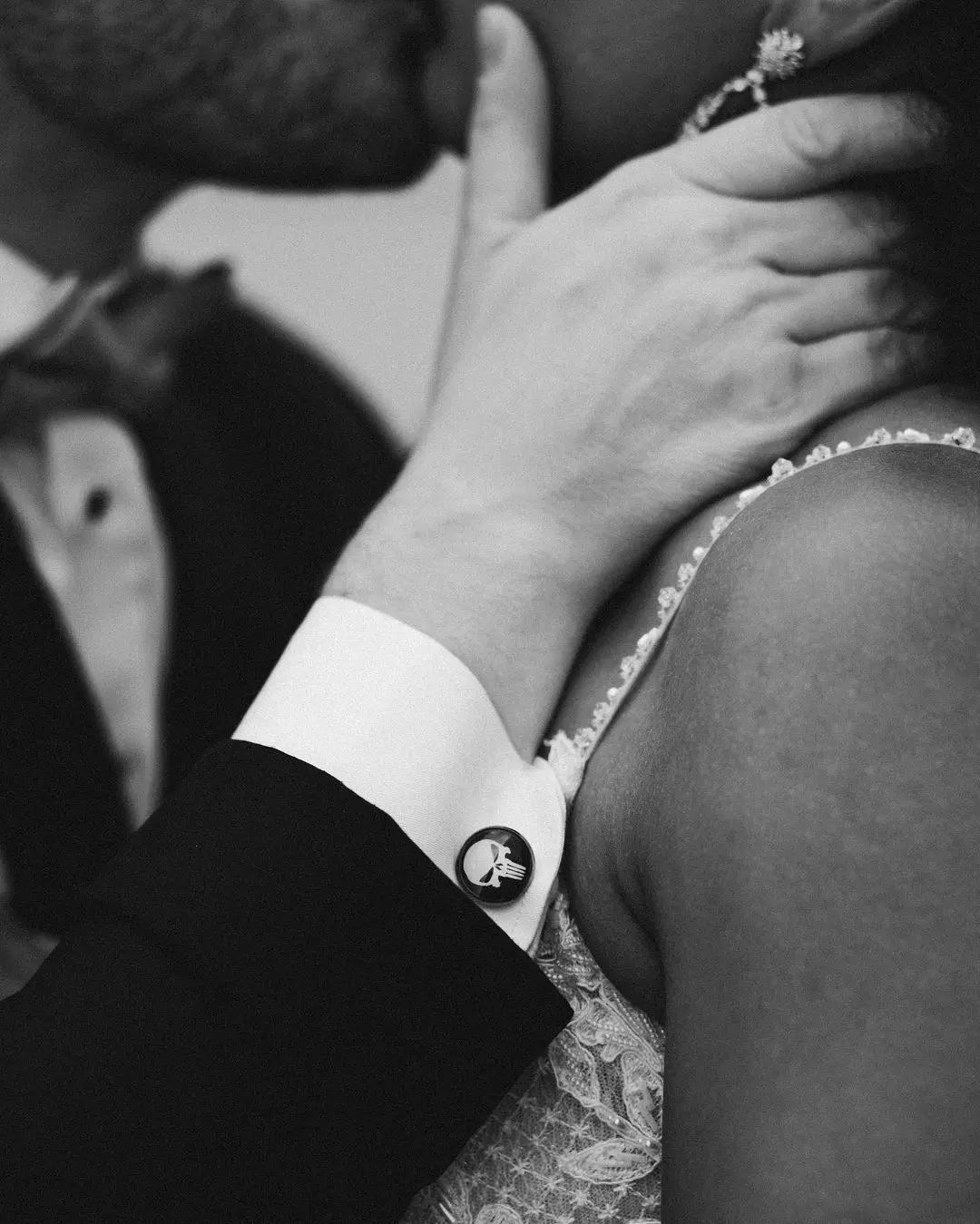 Groom wearing Punisher Cufflinks and Bride Wearing Lace Aline Wedding Dress called Savannah by Maggie Sottero