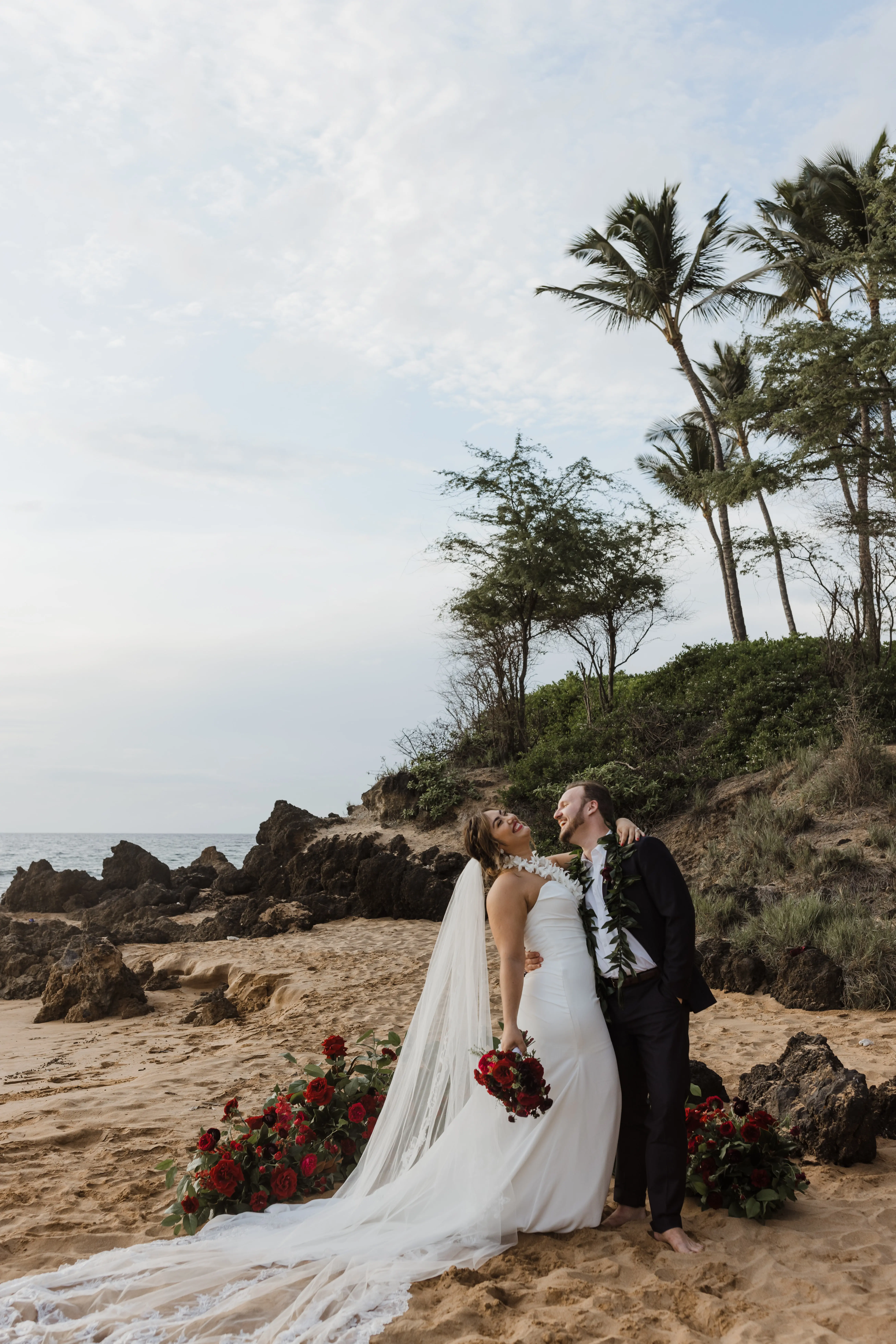 Bride On Beach With Groom In Strapless Wedding Dress Called Monaco By Maggie Sottero
