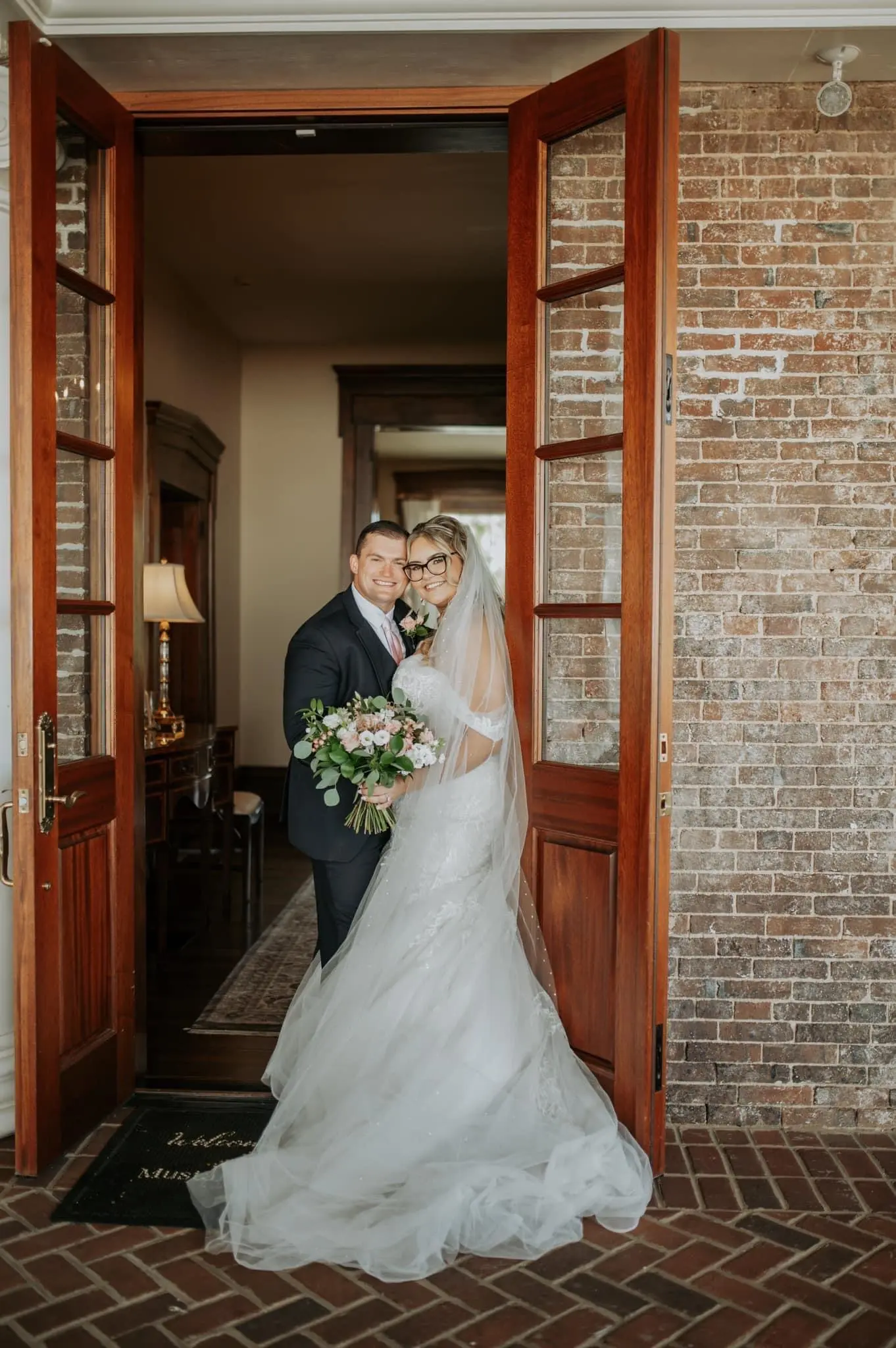 Bride wearing Danielle by Maggie Sottero with her husband