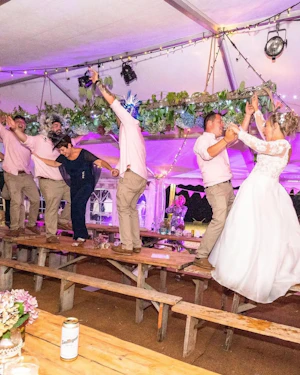 Bride In A-Line Wedding Dress Named Savannah By Maggie Sottero Bride and Groom Dancing On Table