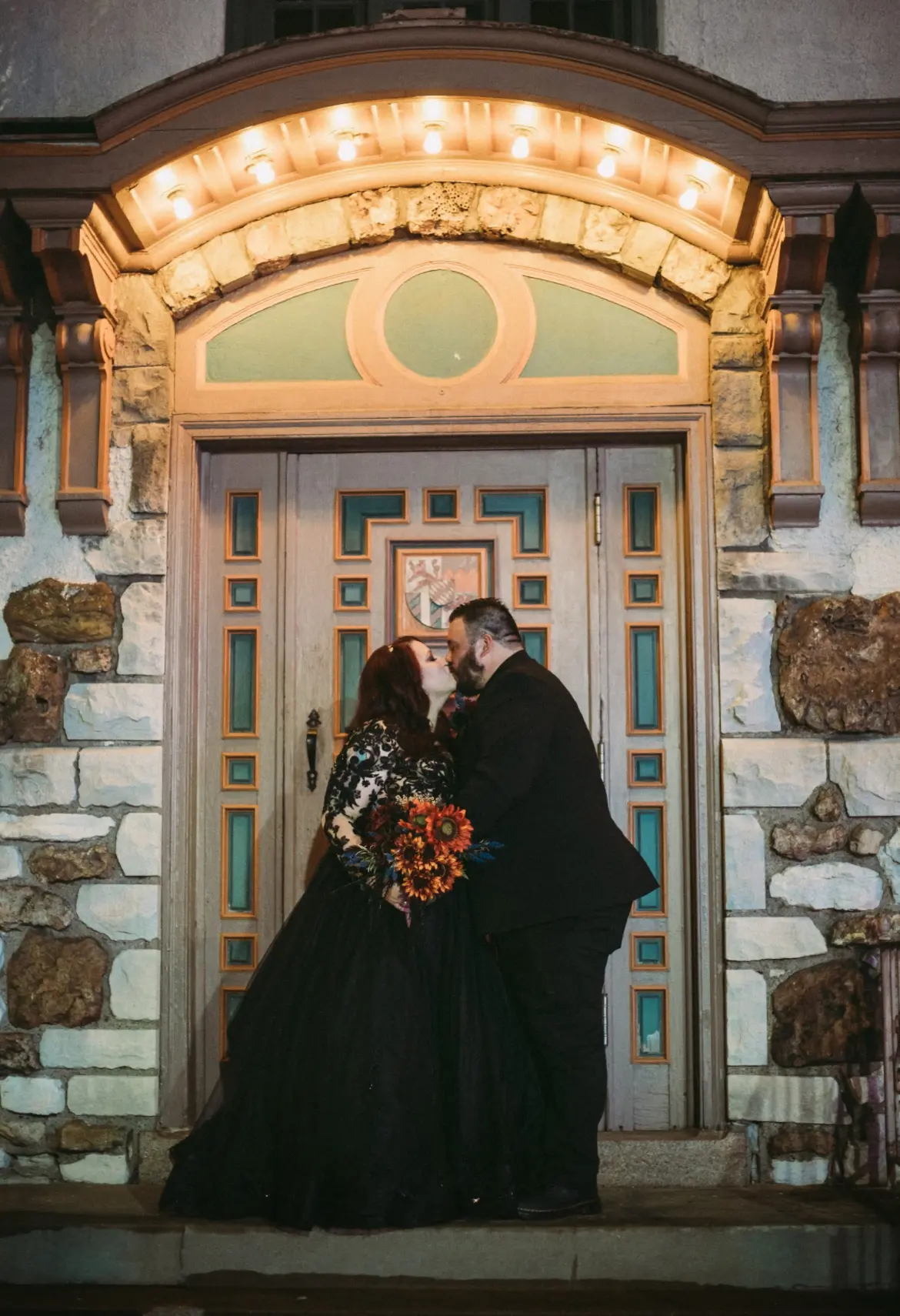 Bride wearing Zander wedding dress by Sottero and Midgley kissing her husband