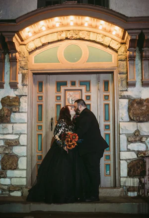 Bride wearing Zander wedding dress by Sottero and Midgley kissing her husband