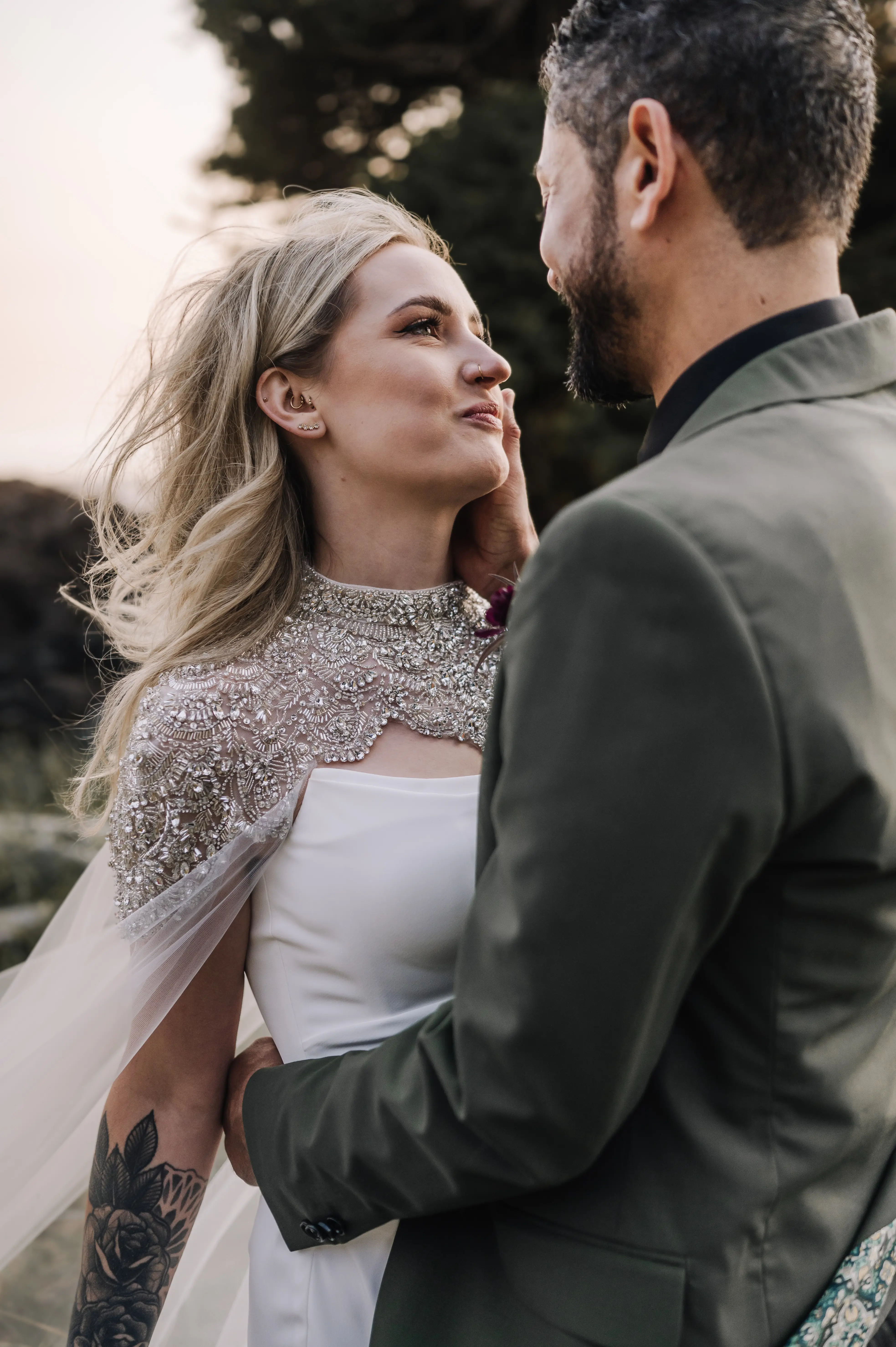 Bride wearing Summer wedding dress by Maggie Sottero with the groom