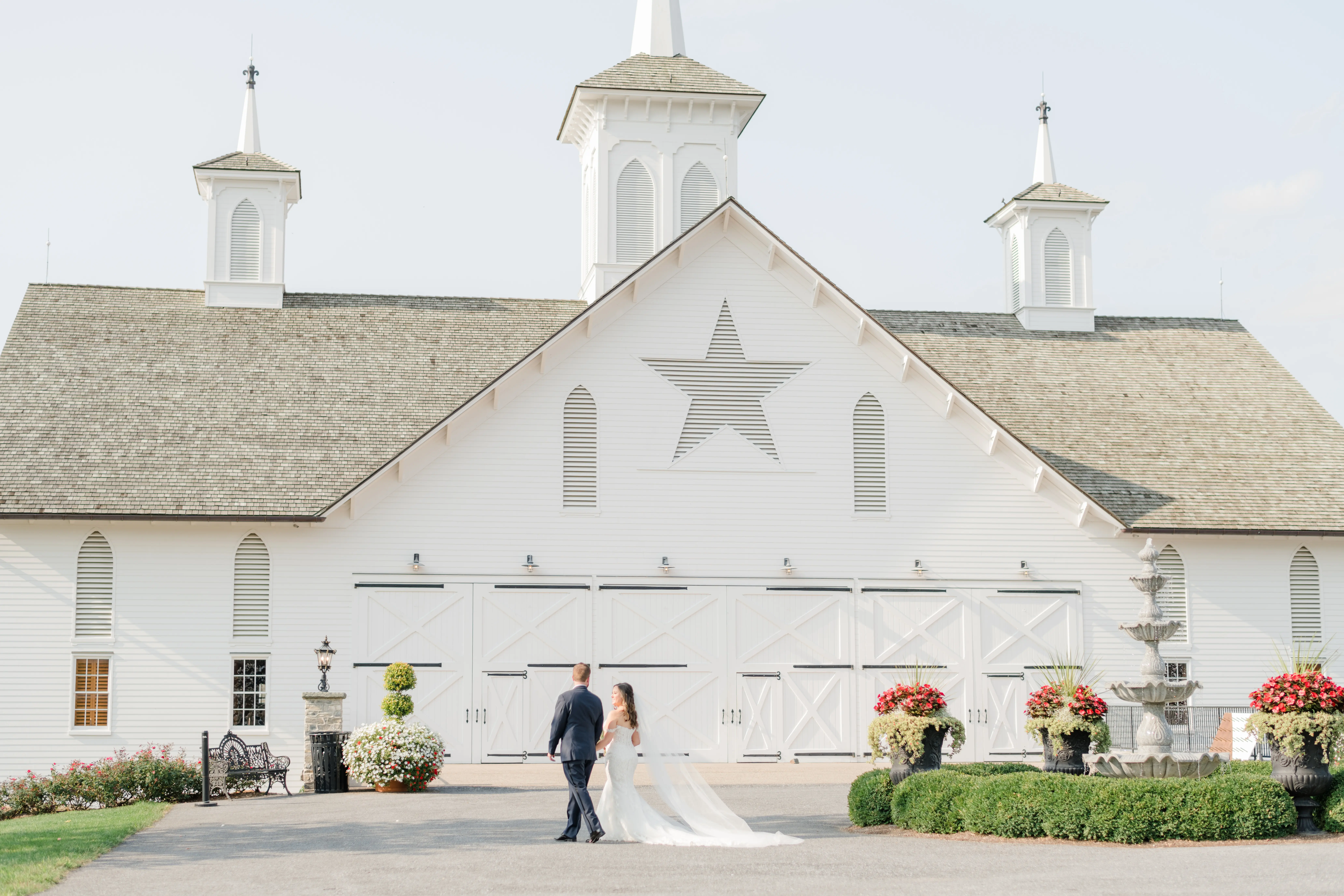 Real bride in sparkly lace fit-and-flare bridal dress with plunging illusion sweetheart neckline called Fiona by Maggie Sottero