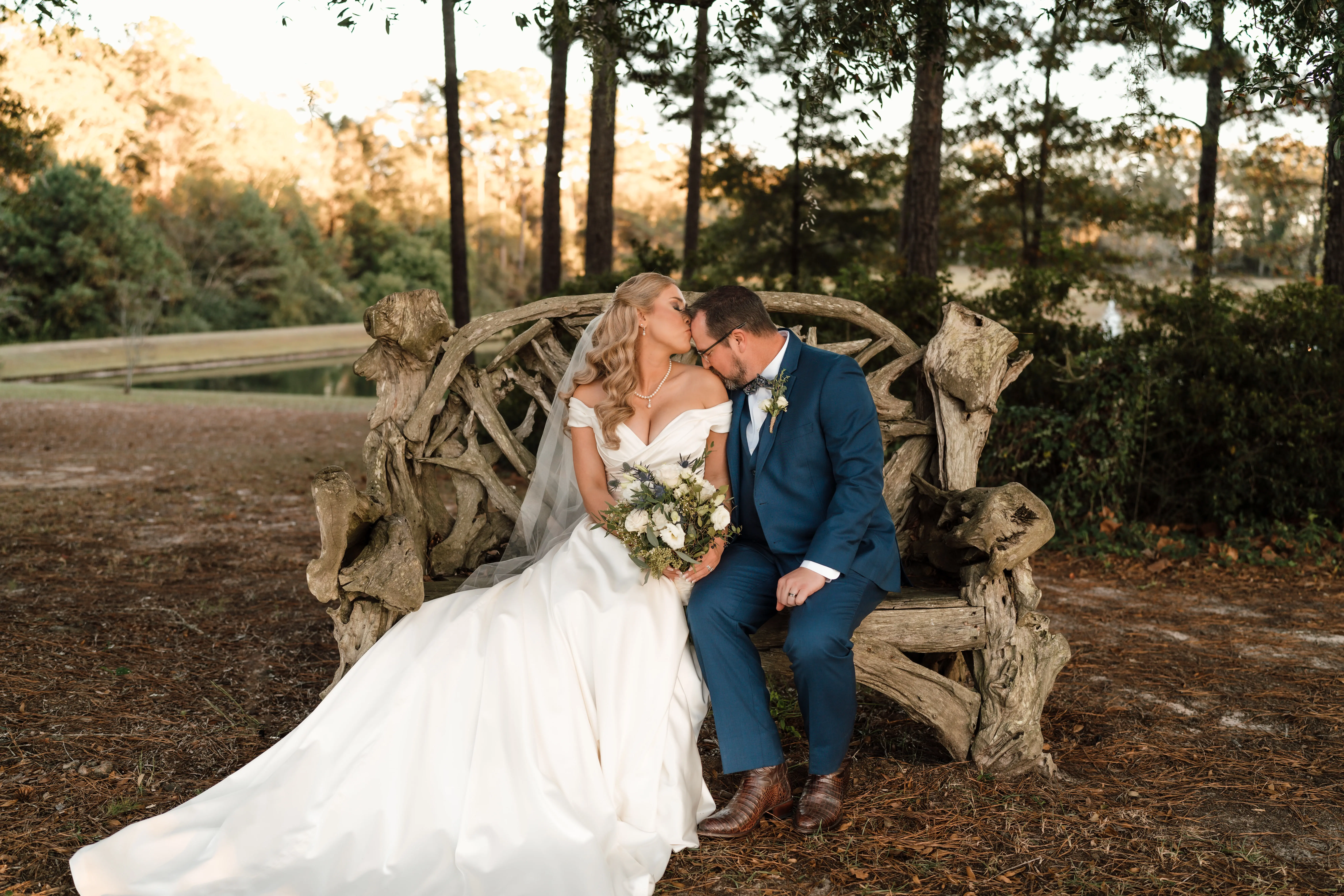 Bride wearing Ekaterina wedding dress by Maggie Sottero kissing her husband