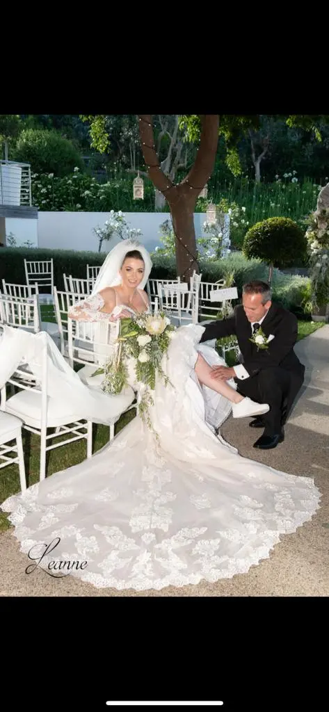 Bride In Lace Fit And Flare Wedding Dress Called Fiona By Maggie Sottero During Garter Toss