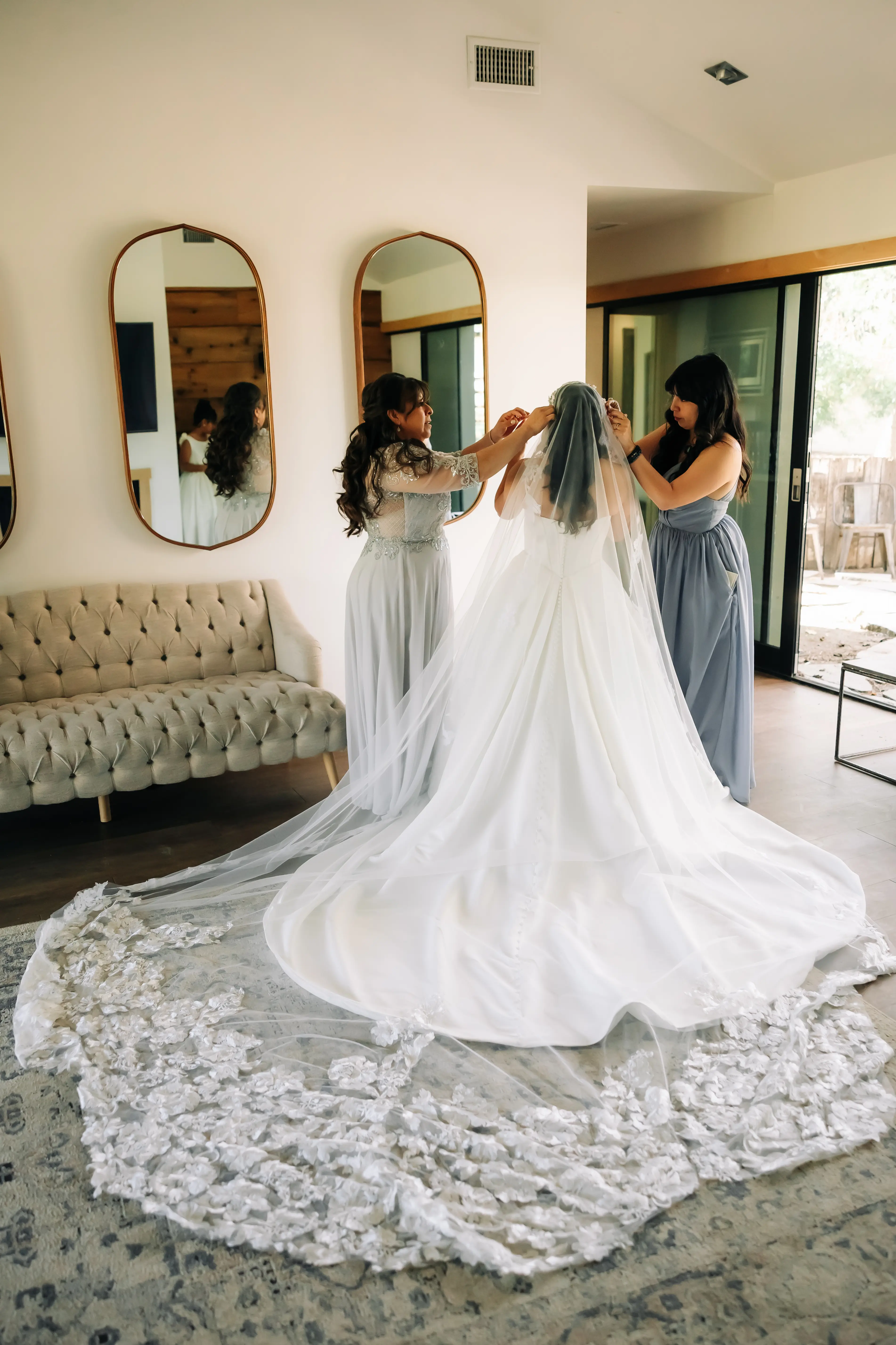 Bride Wearing Sexy Ballgown Wedding Dress Called Derrick By Maggie Sottero Getting Her Veil Put On By Family