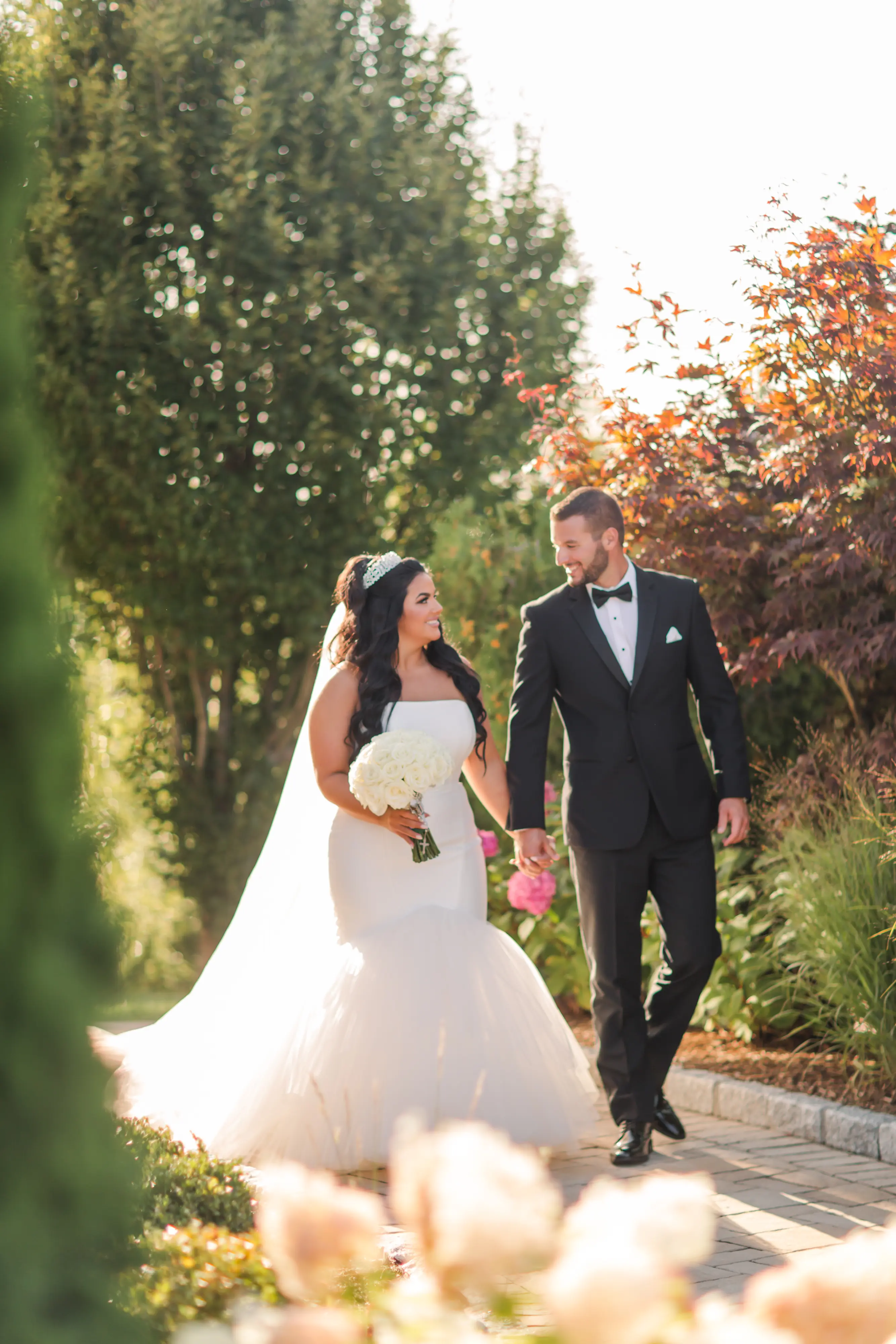 Bride Wearing Simple Mermaid Wedding Dress Called Holden By Sottero And Midgley Holding Hands With Groom