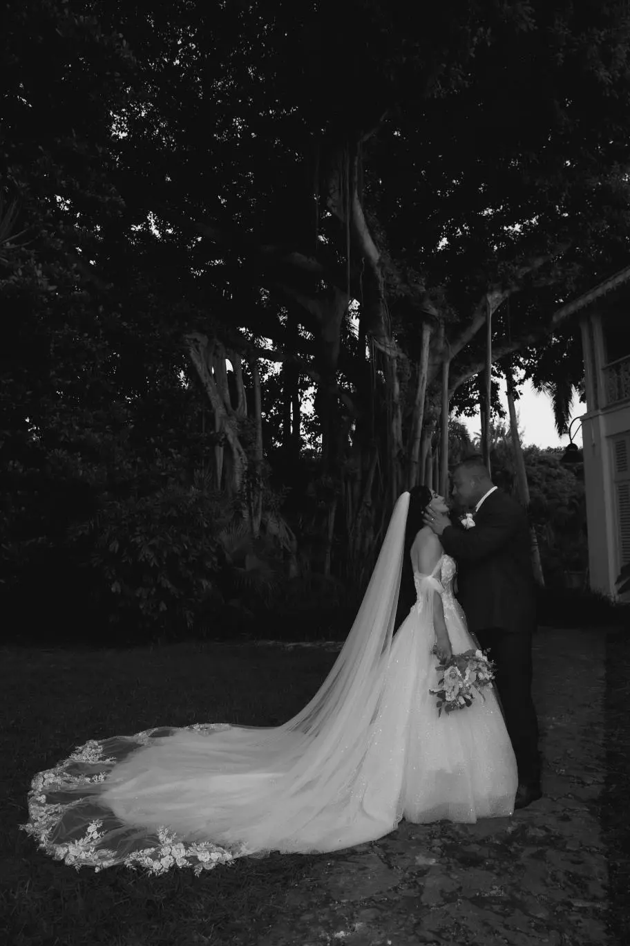 Bride And Groom Standing Together. Bride Wearing Sparkly Fairytale Ball Gown Wedding Dress Called Shasta By Sottero And Midgley