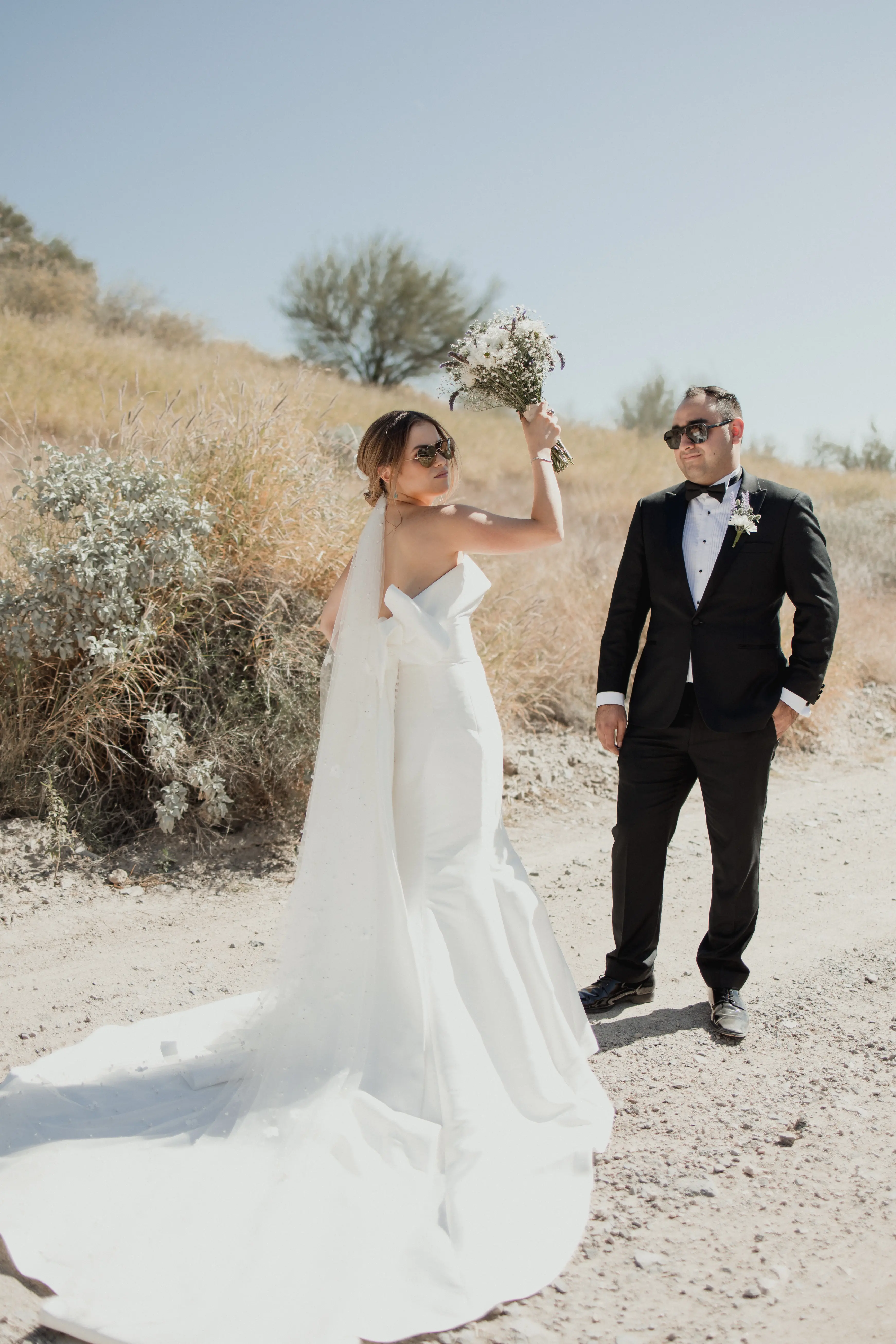Bride In Modern Strapless Wedding Dress Called Mitchell By Maggie Sottero With Groom